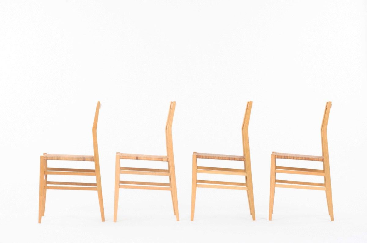 Set of 4 Superleggera chairs designed by Gio Ponti and edited by Cassina in 1980. 
It's the second version of the model, in solid ash structure and braided rush caning seat. 
Cassina label under one chair on the frame. The seat has a nice brown