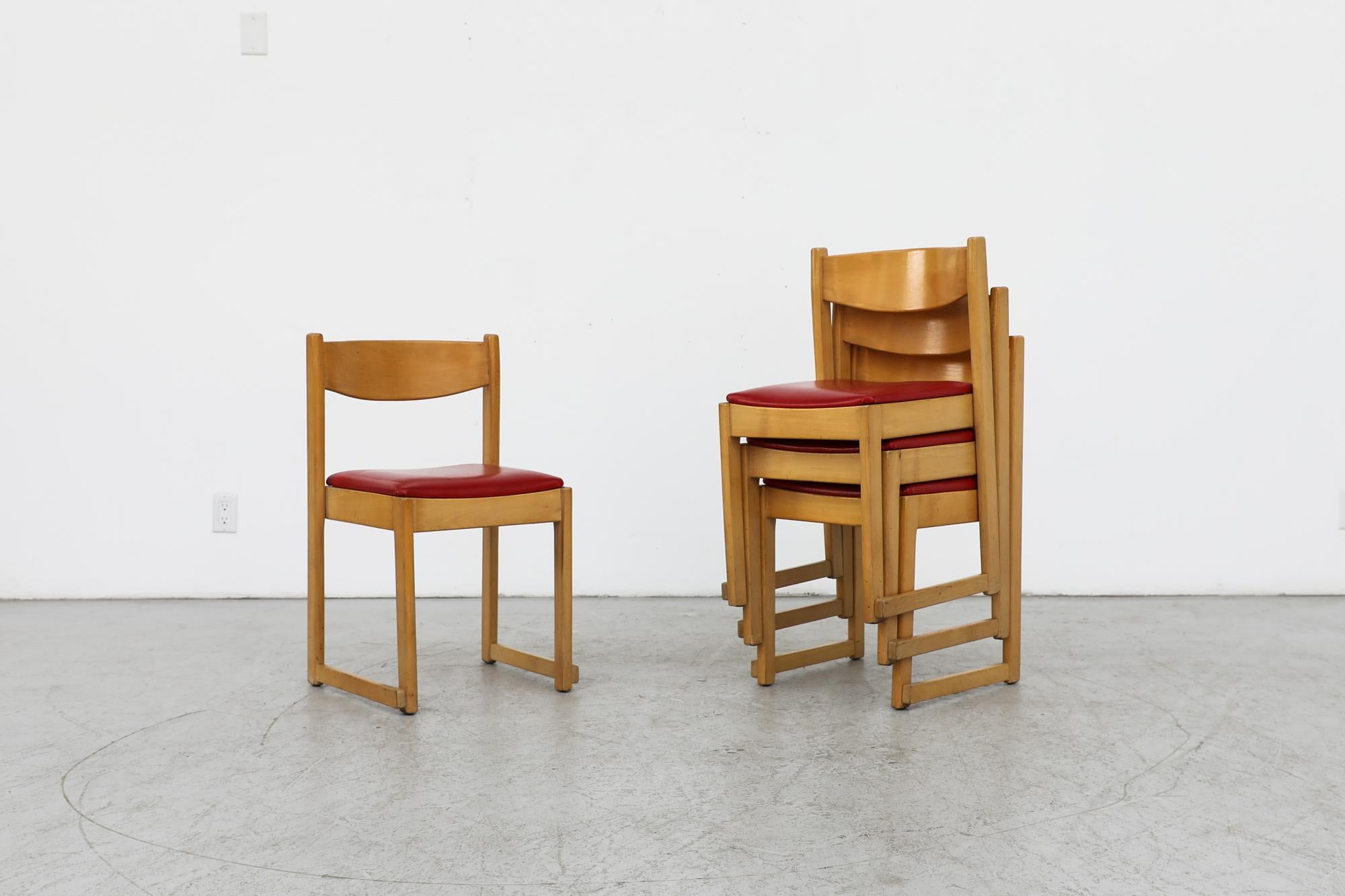 Mid century set of 4 Sven Markelius style stacking dining chairs with blonde oak frames and upholstered red skai seats. The design echoes the 'Orchestra' chairs as designed by Sven Markelius for the Helsingborg theater in the 1930s. In original