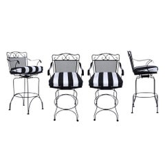 Set of Four Used 1960s Black Iron Patio Swivel Bar Stools