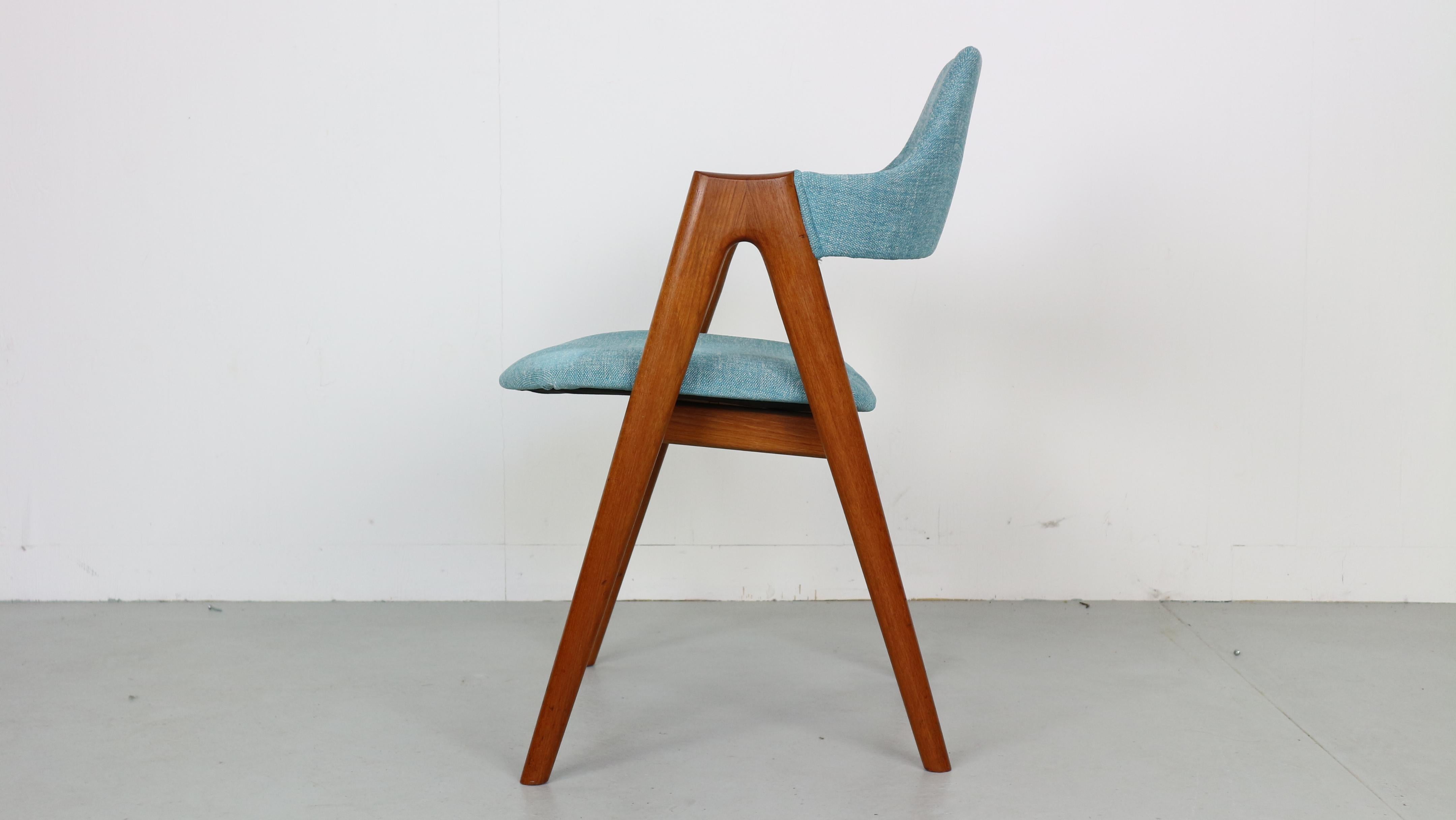 This set of four dining chairs, model compass, are made in solid teak with new upholstery. They were designed by Kai Kristiansen in 1958 and made by SVA Møbler in Denmark.

