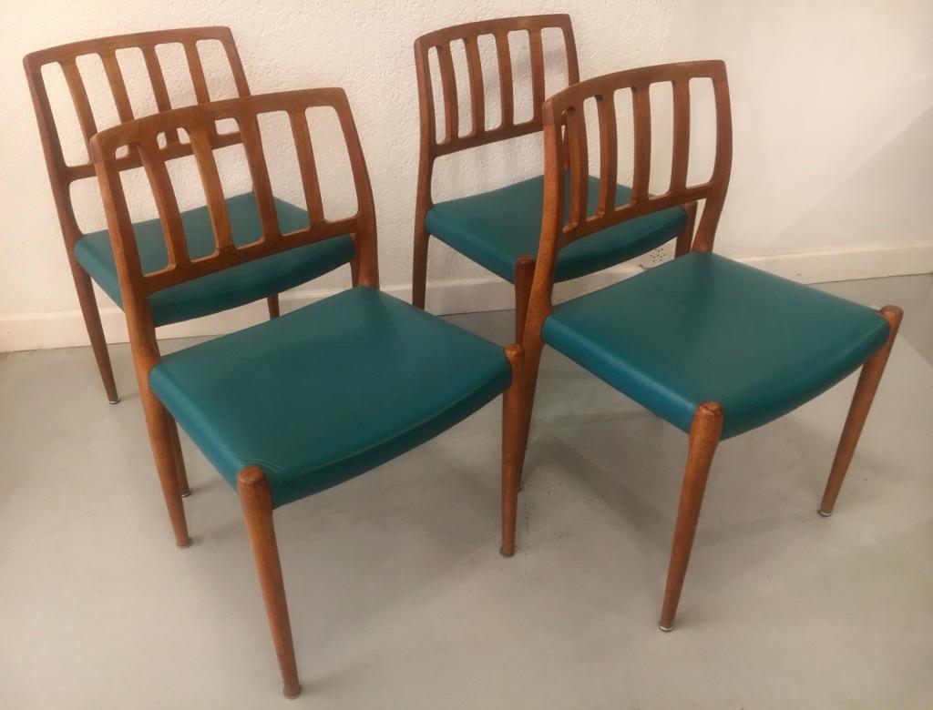 Set of 4 solid teak dining chairs model 83 by Niels O. Møller produced by J.L. Møllers Møbelfabrik, Denmark circa 1960
reupholstered with a turquoise faux leather.
  
