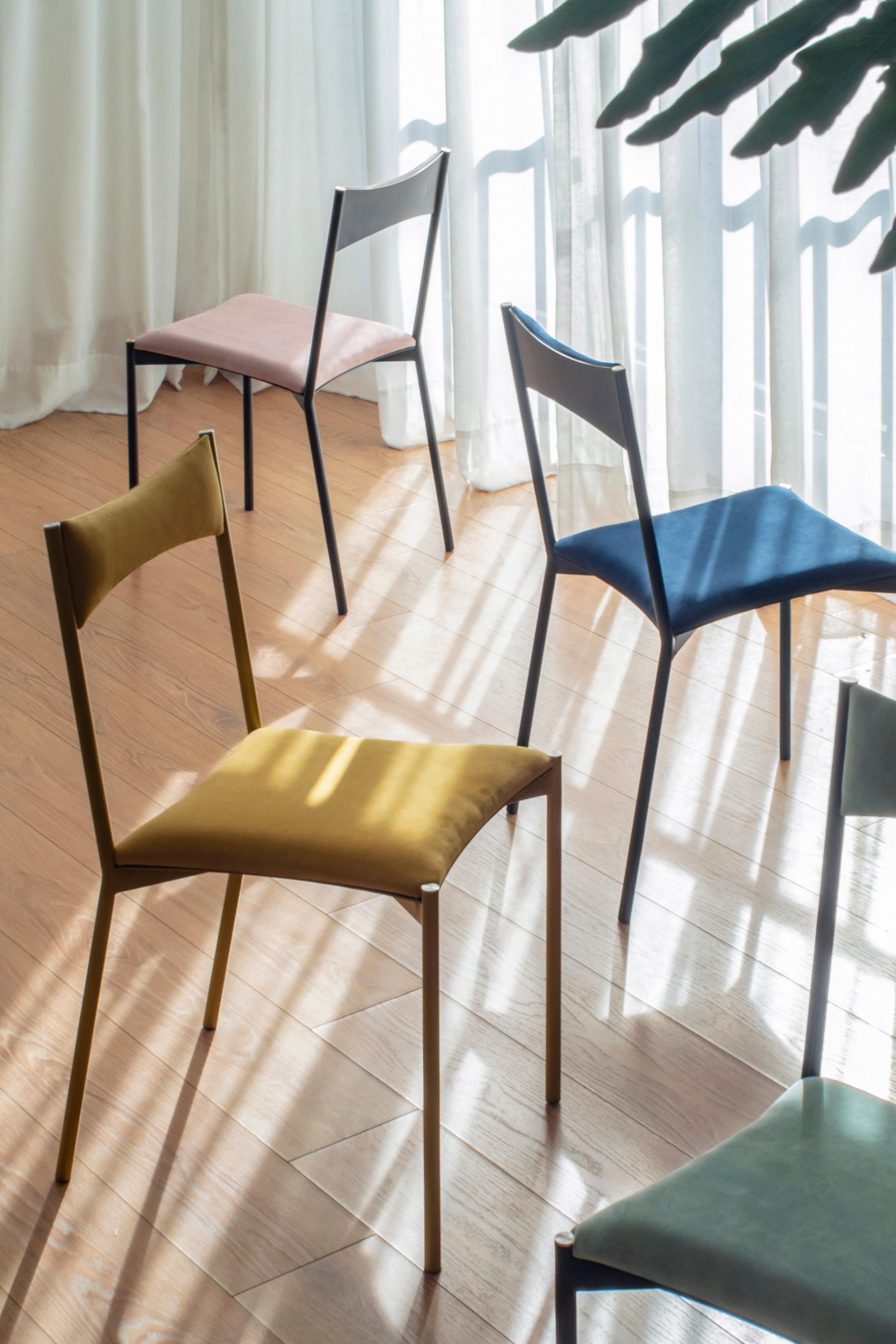 A set of 4 tensa chairs ( green, blue, yellow, pink ) by Ries
Dimensions: W40 x D49,5 x H82 cm 
Materials: Round steel tube, laser cut metal sheet, high density foam, velvet upholstery, aluminum/bronze caps
Matte powder coated painting