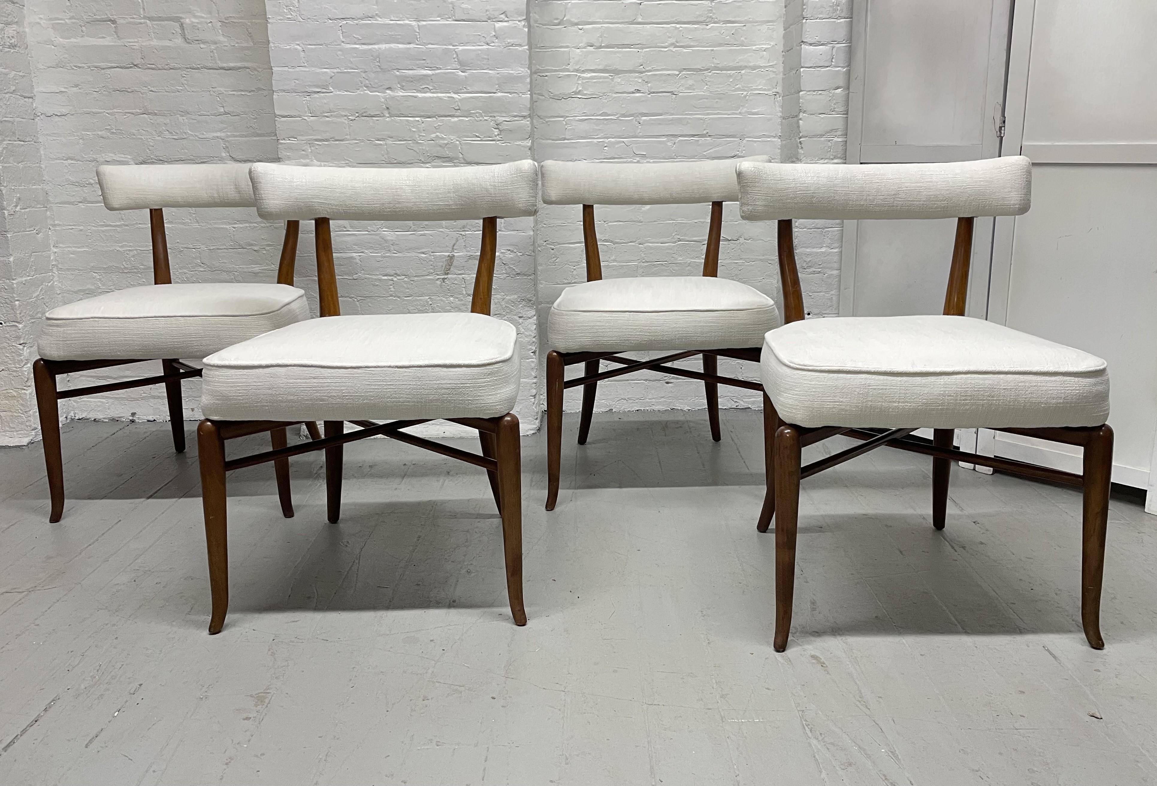 Set of 4 T.H. Robsjohn-Gibbings Klismos chairs with sculptural walnut frames, double stretcher bases and newly upholstered.