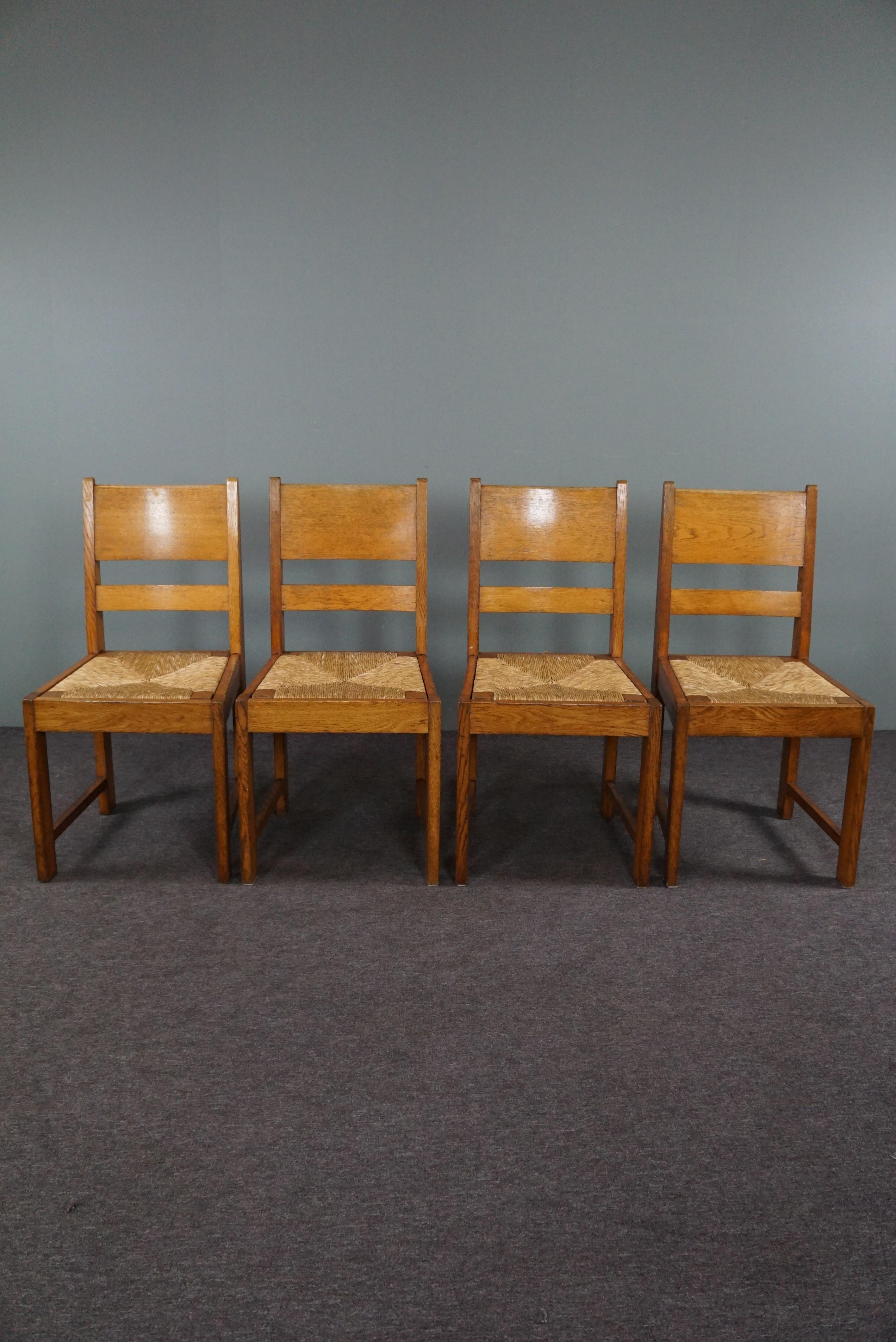 Offered is this very beautiful set of 4 oak The Hague School dining room chairs.

This rare set of dining room chairs in The Hague School style was developed around 1940. The seating of this set is very comfortable and such furniture fits well in