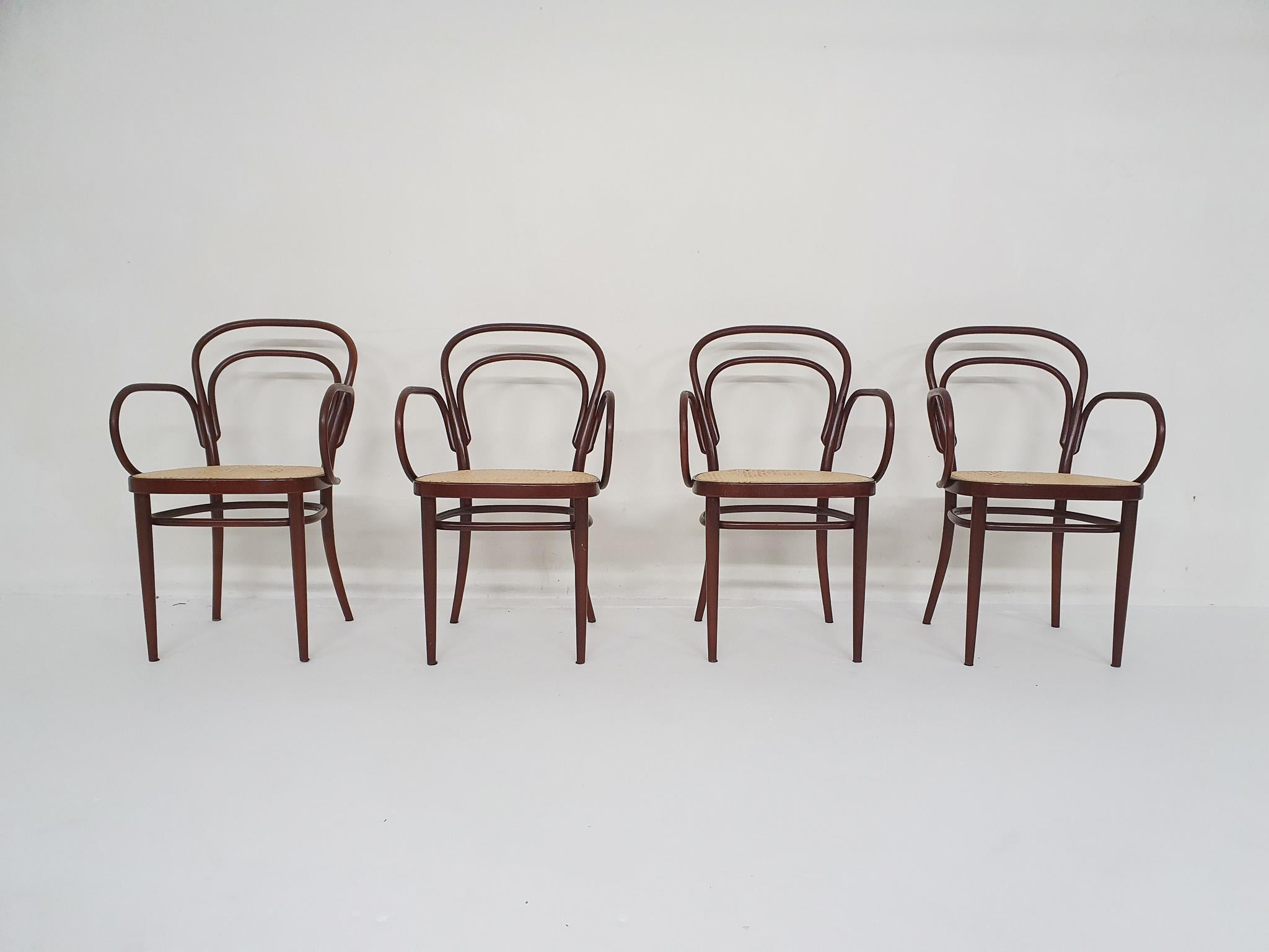 Dark brown dining chairs with webbing seats. In good condition.