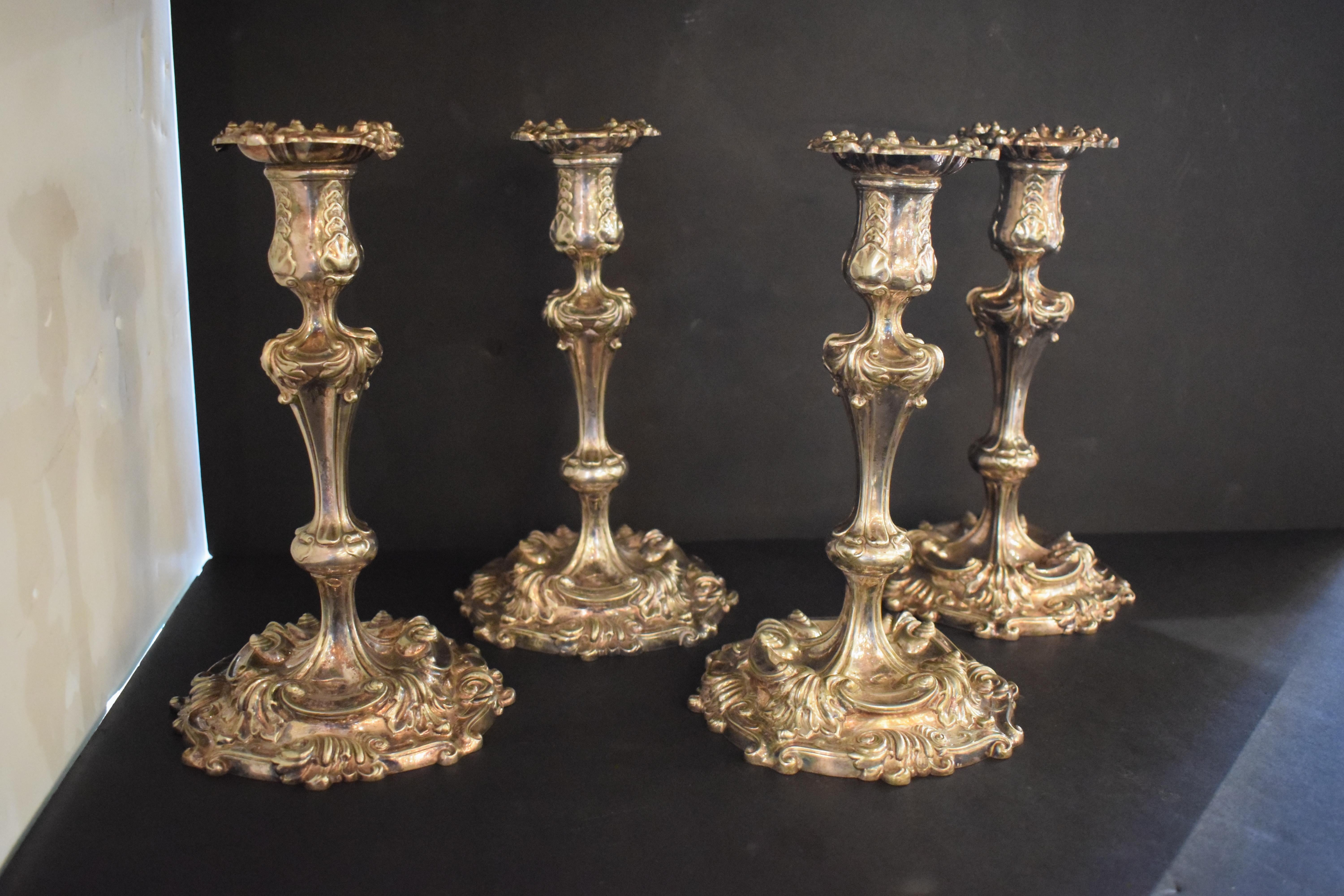 A Fine Set of 4 Candlesticks in the Rococo taste by Tiffany & Co. 3 of them stamped in the bottom 