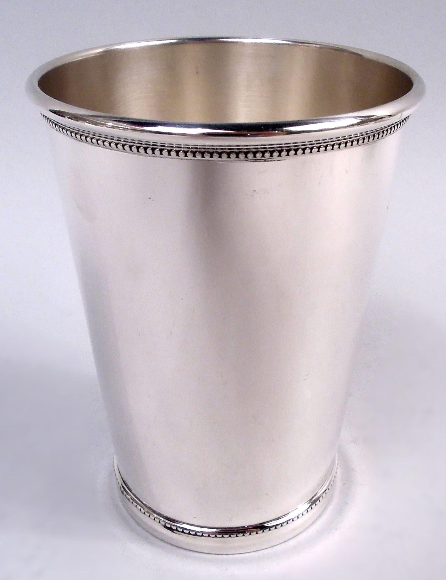 Set of 4 American sterling silver mint julep cups. Each: Straight and tapering sides; beaded mouth and base. Julep style, highball size. Marked “Tiffany & Co. / 925 Sterling”. Total weight: 22 troy ounces. 