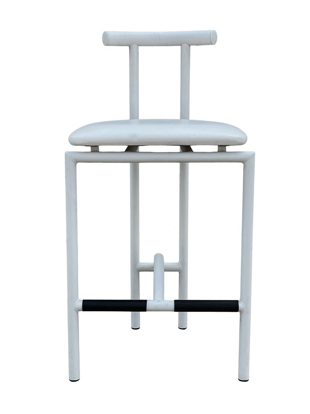 A complete set of four bar or counter stools by Rodney Kinsman for Bieffeplast, Italy, 1985. These are rarely seen in all white. Stools consist of metal tubular construction, black rubber foot rests, white vinyl seats. Cushions should be recovered.