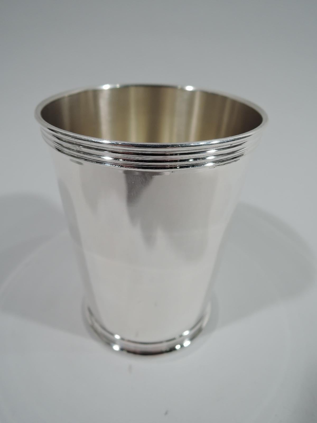 Set of 4 traditional sterling silver mint julep cups. Made by Manchester in Providence. Each: Straight and tapering sides, and reeded rim and foot. Fully marked including maker’s stamp and no. 3759. Total weight: 16 troy ounces.