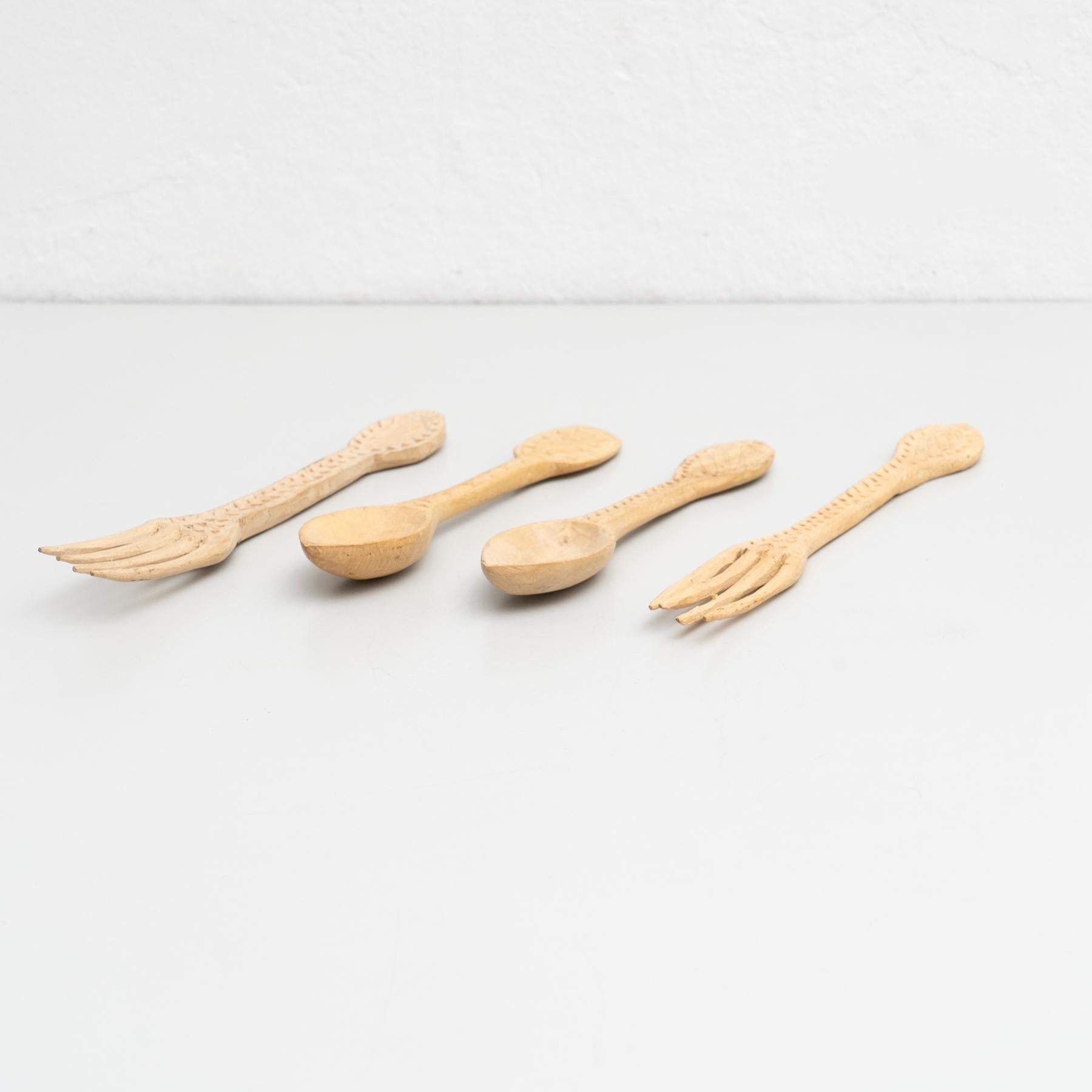 Traditional pastoral primitive set of wooden carved fork and spoons.

Handmade in Spain, circa 1900.

In original condition, with minor wear consistent with age and use, preserving a beautiful patina.

Materials:
Wood.

Dimensions:
Forks: