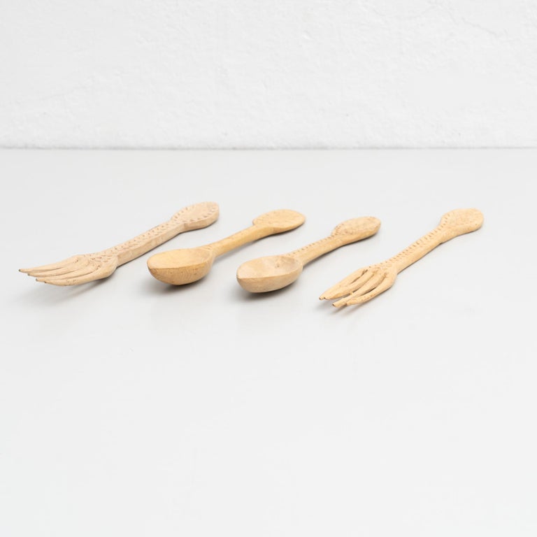 Traditional pastoral primitive set of wooden carved fork and spoons.

Handmade in Spain, circa 1900.

In original condition, with minor wear consistent with age and use, preserving a beautiful patina.

Materials:
Wood.

Dimensions:
Forks: