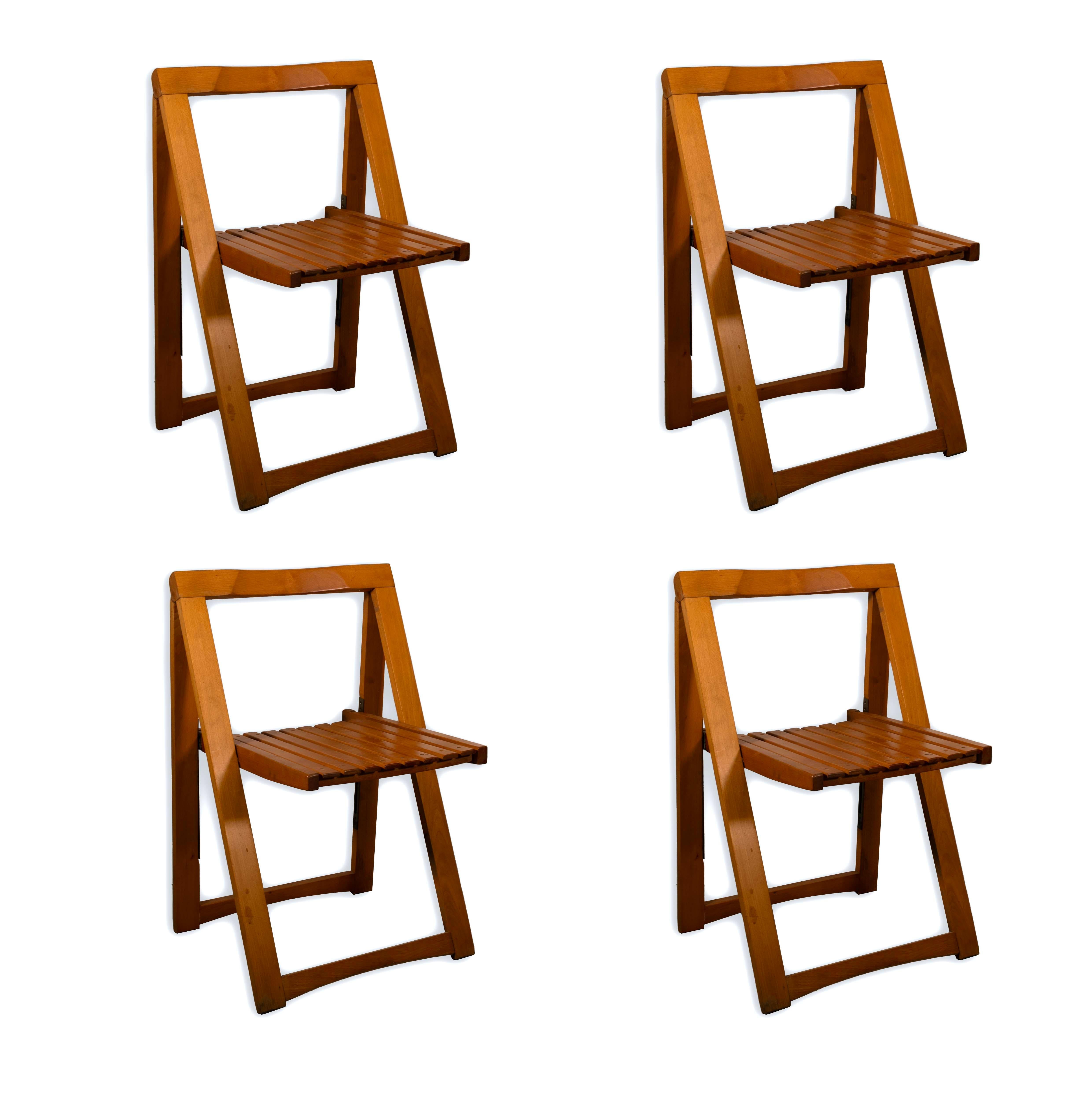 This set of 4 Trieste 1960s Aldo Jacober Folding Chairs are the perfect addition to your mid century modern collection. Stunningly crafted, these Italian made chairs are both comfortable and ready to place wherever your heart desires due to their