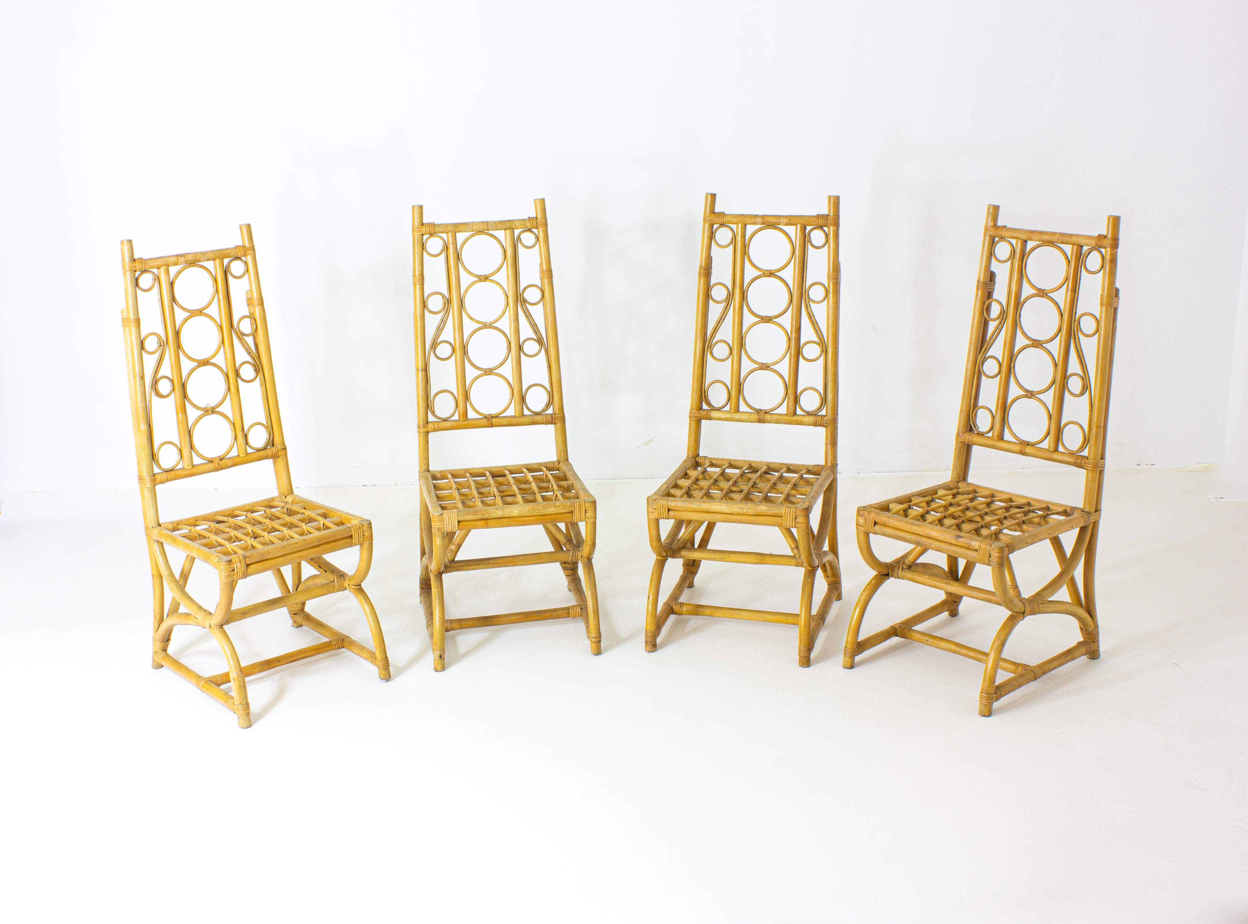 Hollywood Regency Set of 4 tropically ornate bamboo chairs. For Sale