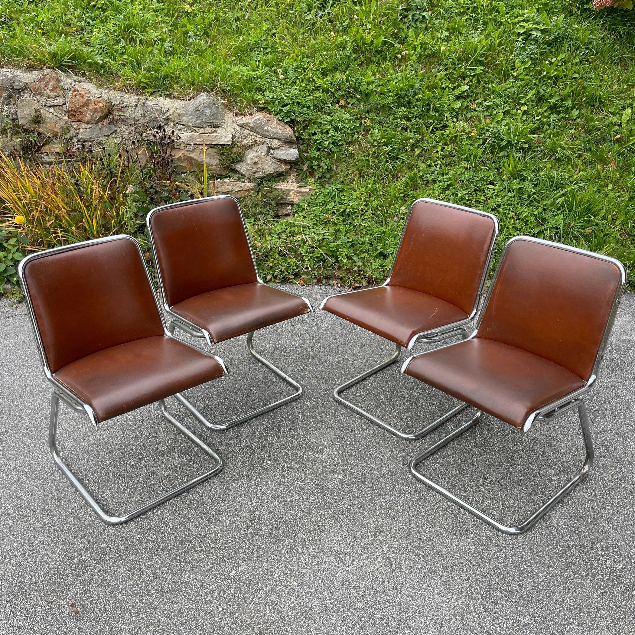 The extremely comfortable and amazing set of 4 mid-century chairs were made in Italy in the 1970s. Italian industrial production. Good vintage condition. The photographs show signs of wear and tear. There are traces of natural patina on the metal.