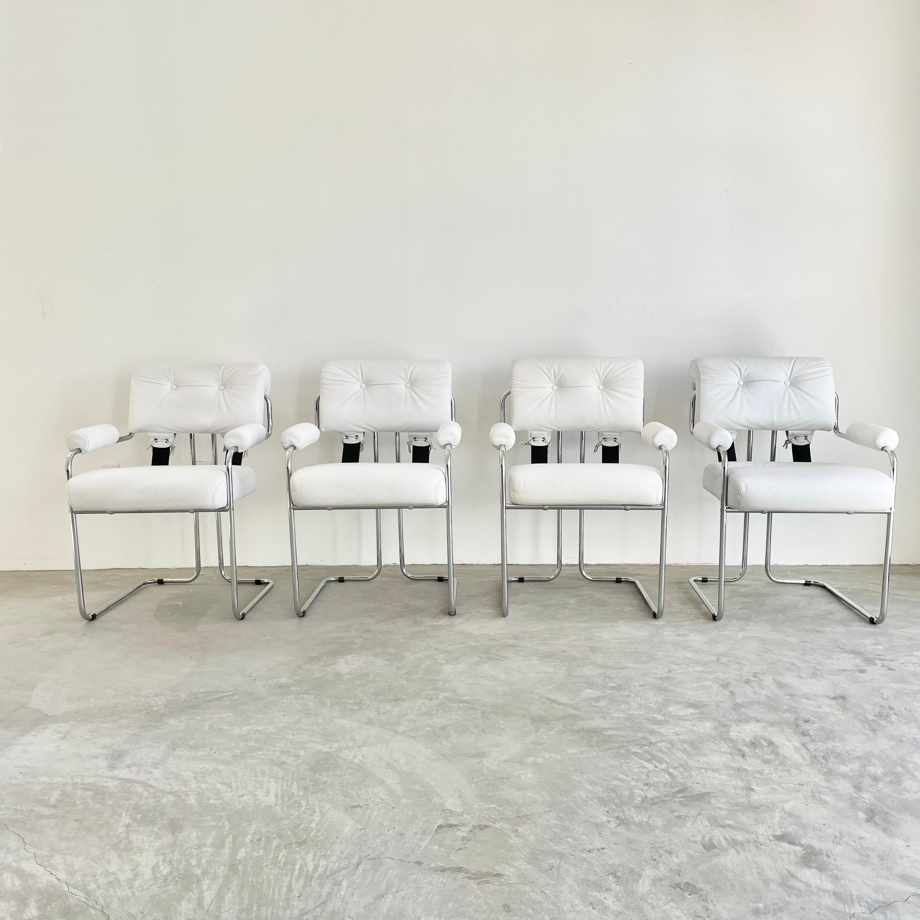 Stunning set of leather chairs by Guido Faleschini for Mariani, Pace. Unusual set in that they all have leather armrests. Chairs with white leather seat, seat back and armrests. Thick black leather straps fasten the seat back to the seat. Great