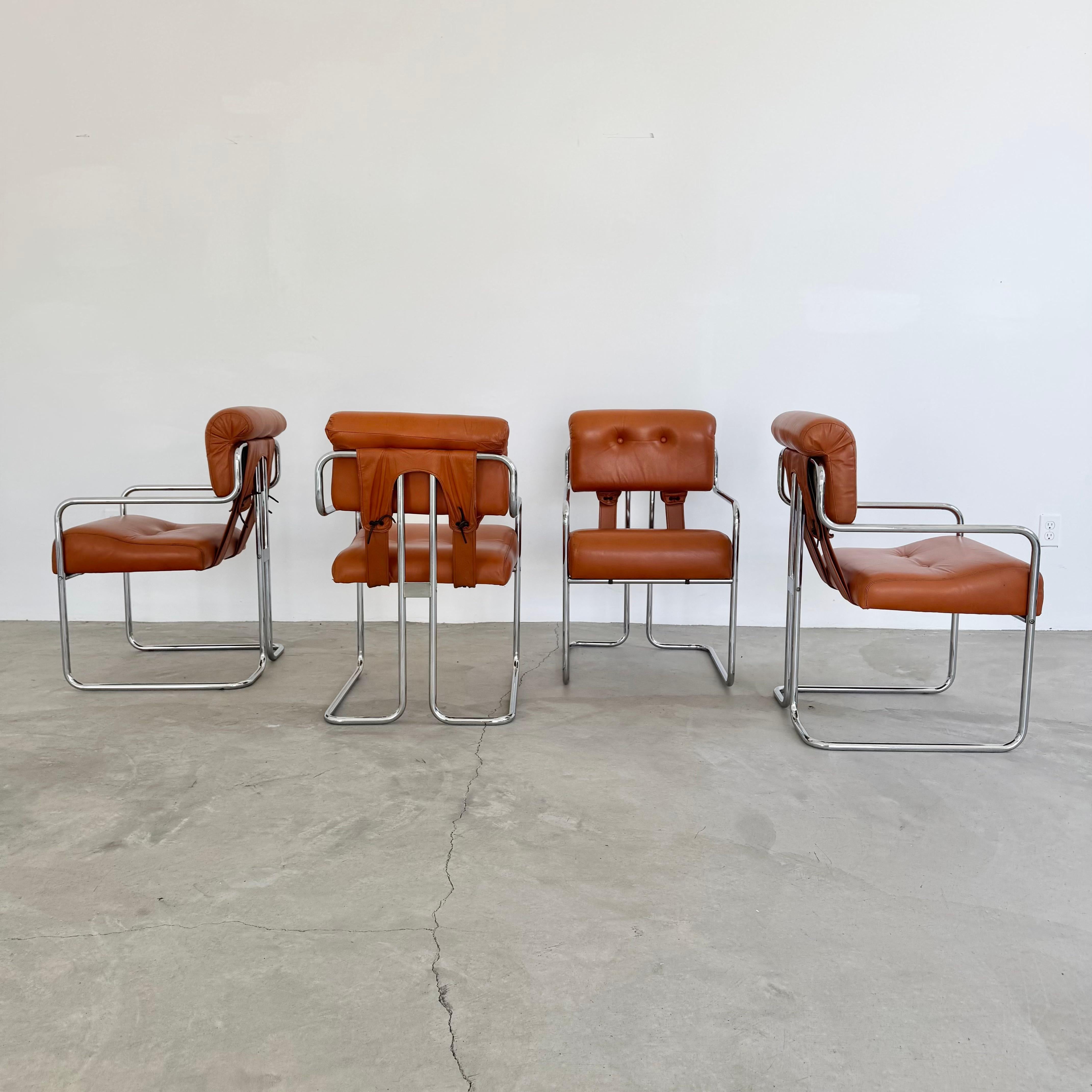 Stunning set of 4 Tucroma chairs by Guido Faleschini for Mariani, Pace. A staple of beautiful modern Italian design, these chairs will transform any room or dining area. This iconic set features polished tubular chrome cantilever frames supporting