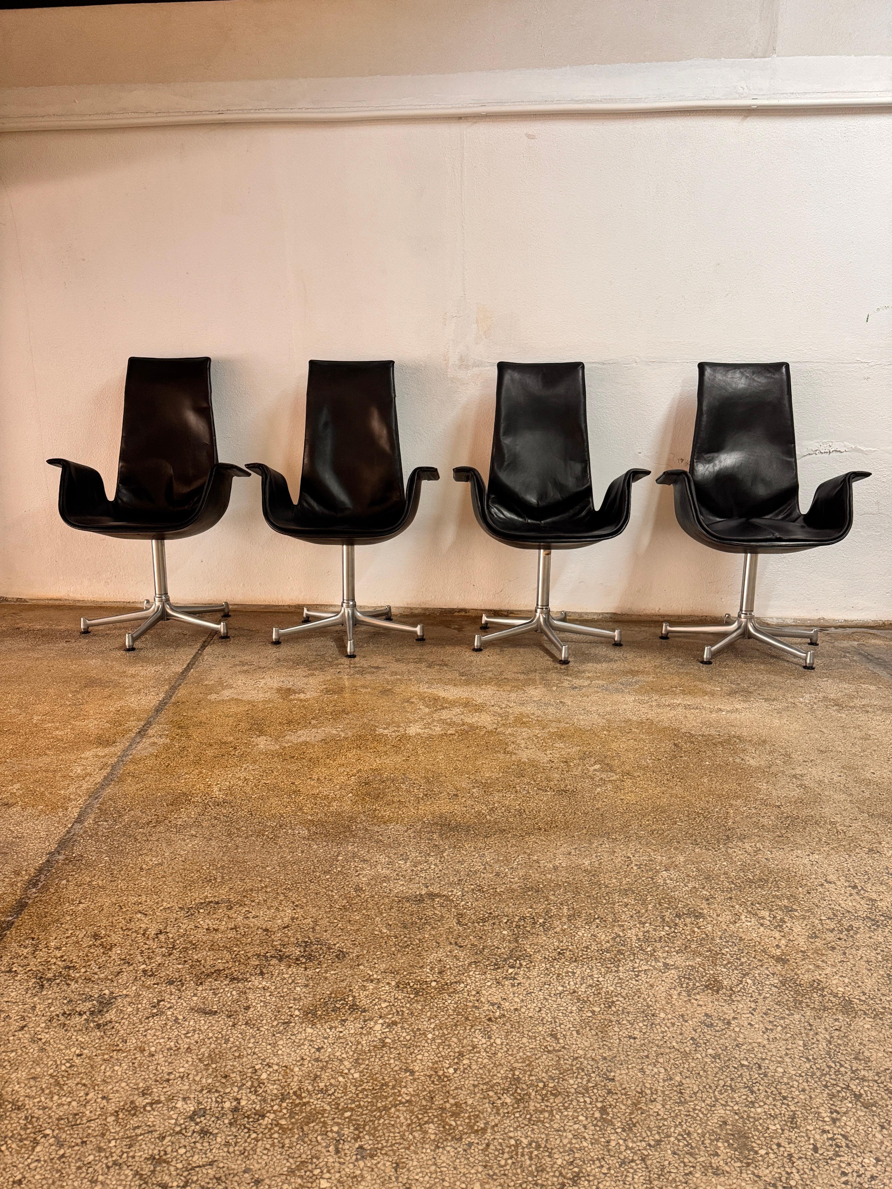 This set of four FK6725 Tulip Chairs, designed by Preben Fabricius & Jørgen Kastholm for Kill International in the 1960s, is an iconic representation of mid-century modern design. Introduced in 1964, this groundbreaking swivel armchair won the