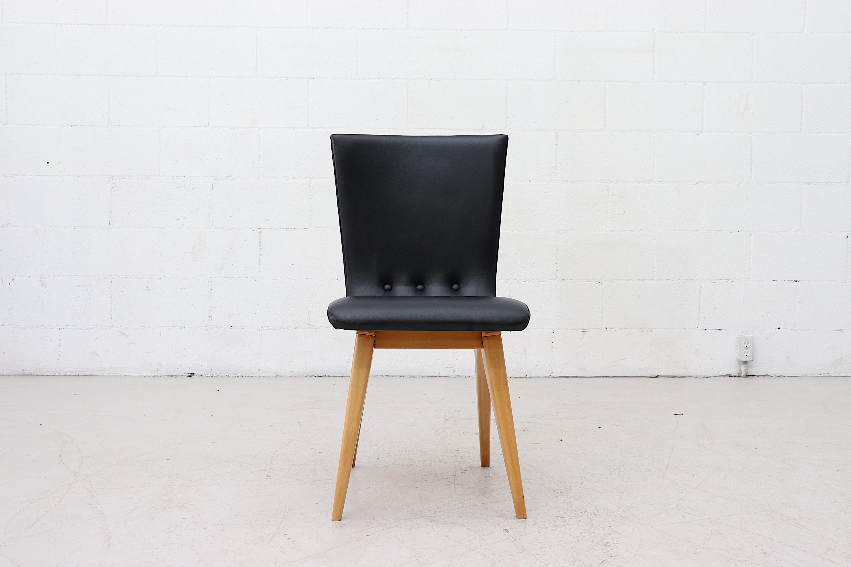 Beautiful swooping dining chairs by Van Os, Culemborg, in faux black leather and bold curved wood legs. In good condition. Set price.