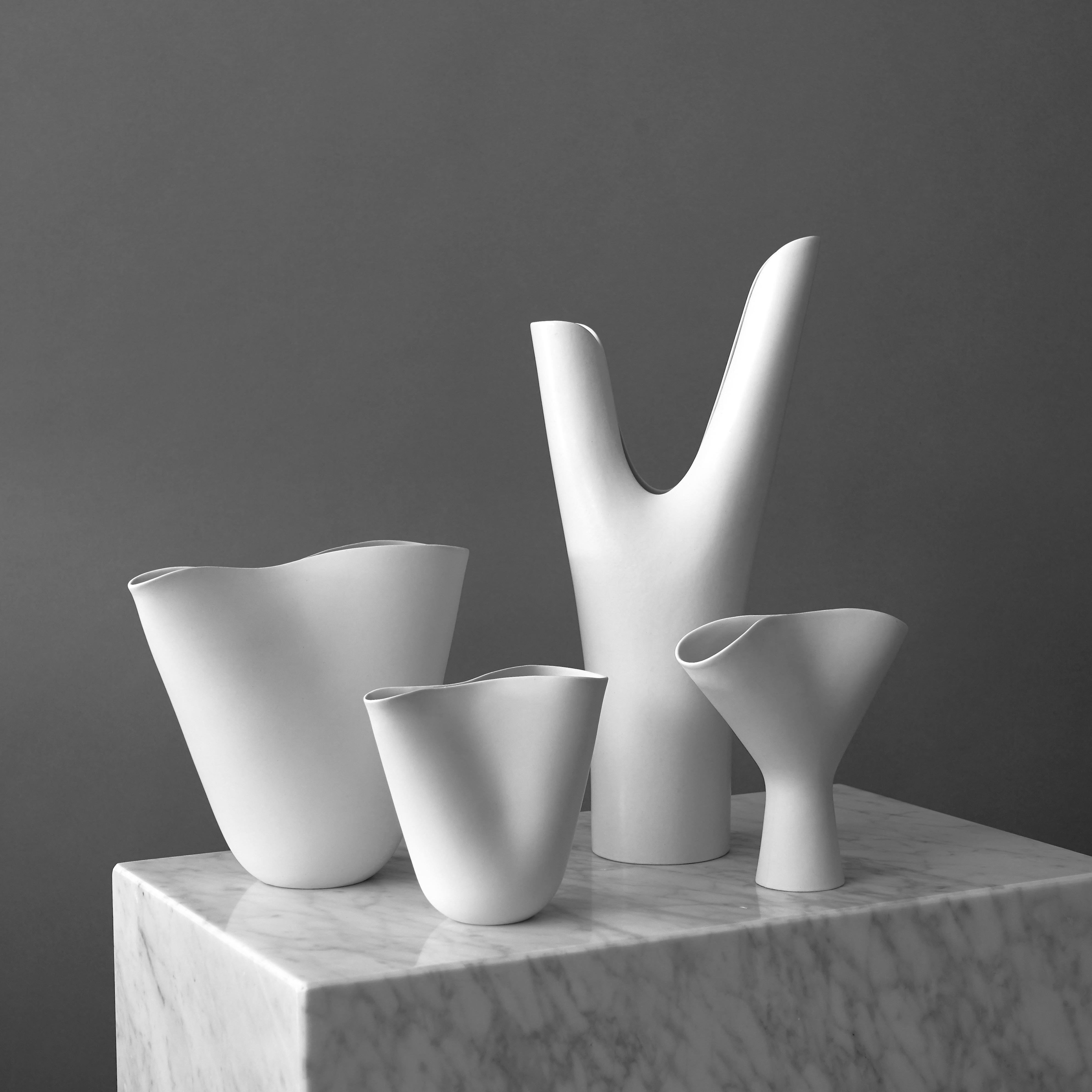 A set of 4 beautiful 'Veckla' vases.
Made by Stig Lindberg in Gustavsberg Studio, Sweden, 1950s.

Excellent condition.
Impressed Gustavsberg studio hand.
The largest vase is 36 cm tall (14.2 in.).

Stig Lindberg’s “Veckla” vases belong to a series