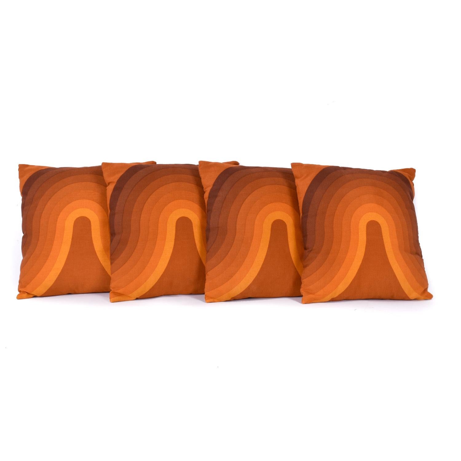 Set of 4 Mid-Century Modern decorative pillows made with Verner Panton fabric. These pillows have some age to them, but look hardly used. The pillows were custom made using Verner Panton’s orange “Kurve” fabric 47806. Panton designed the “Kurve” or
