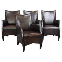 Ensemble de 4 très belles chaises de salle à manger en peau de mouton