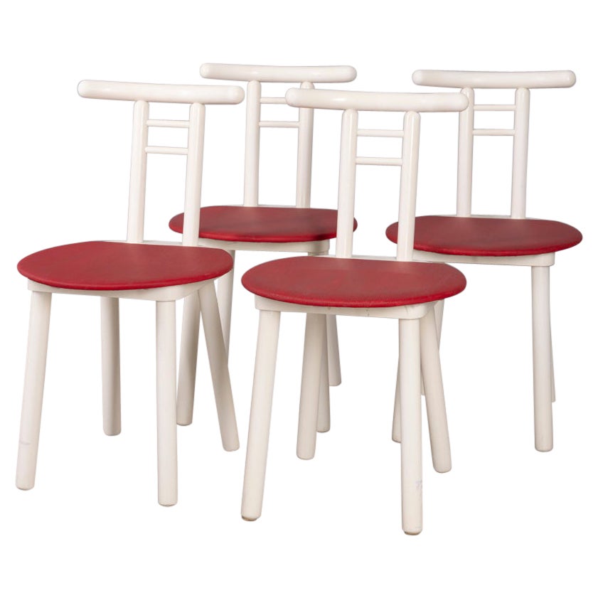 Set of 4 vintage 1980s chairs made of wood and red vinyl, Italian design