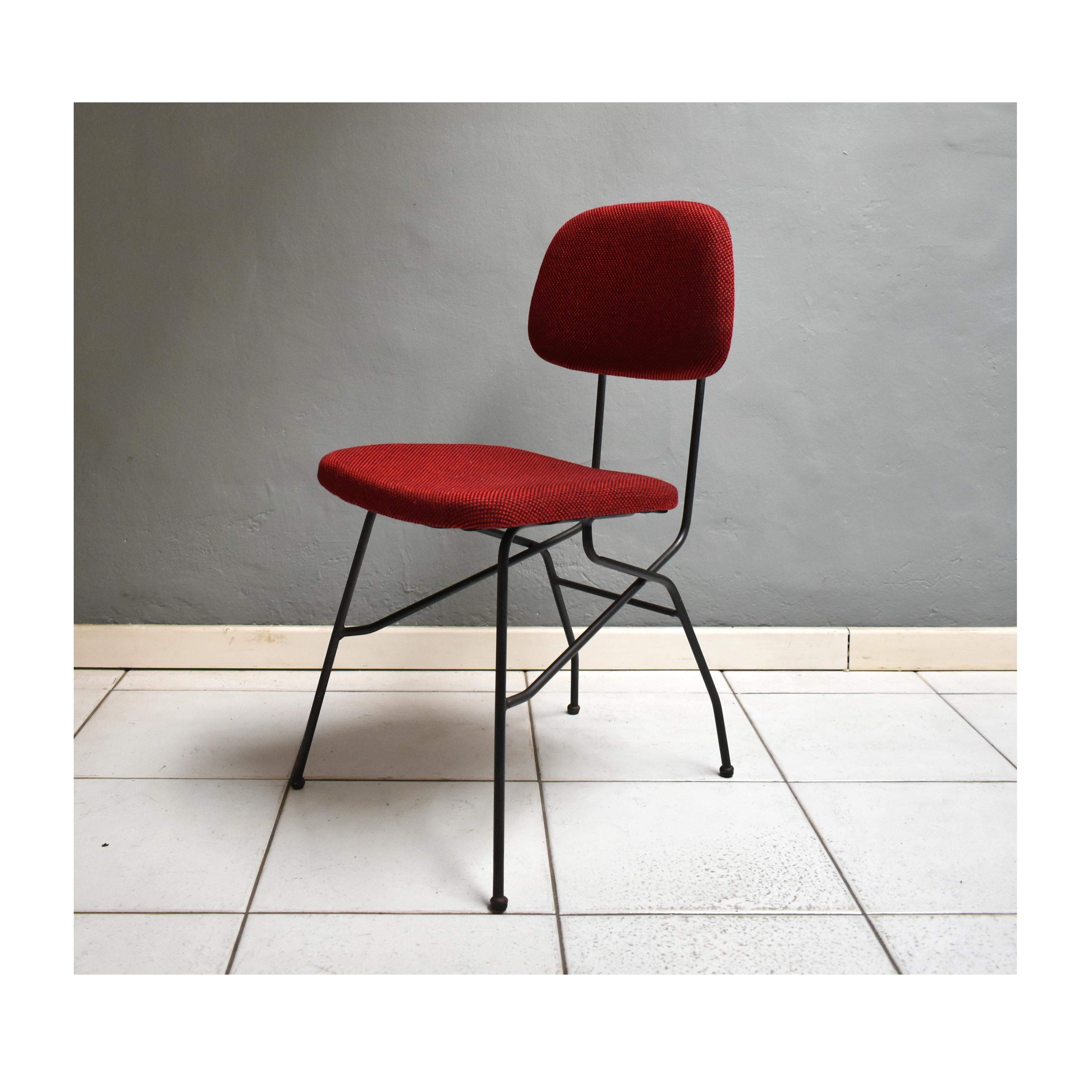 Set of four vintage sixties chairs, Italian manufacture.
The chairs have a black iron structure with seat and back in red-bordeaux fabric with black dots. On the back of the back there are brass buttons.

Measures
Height: 78 cm
Seat height: 44