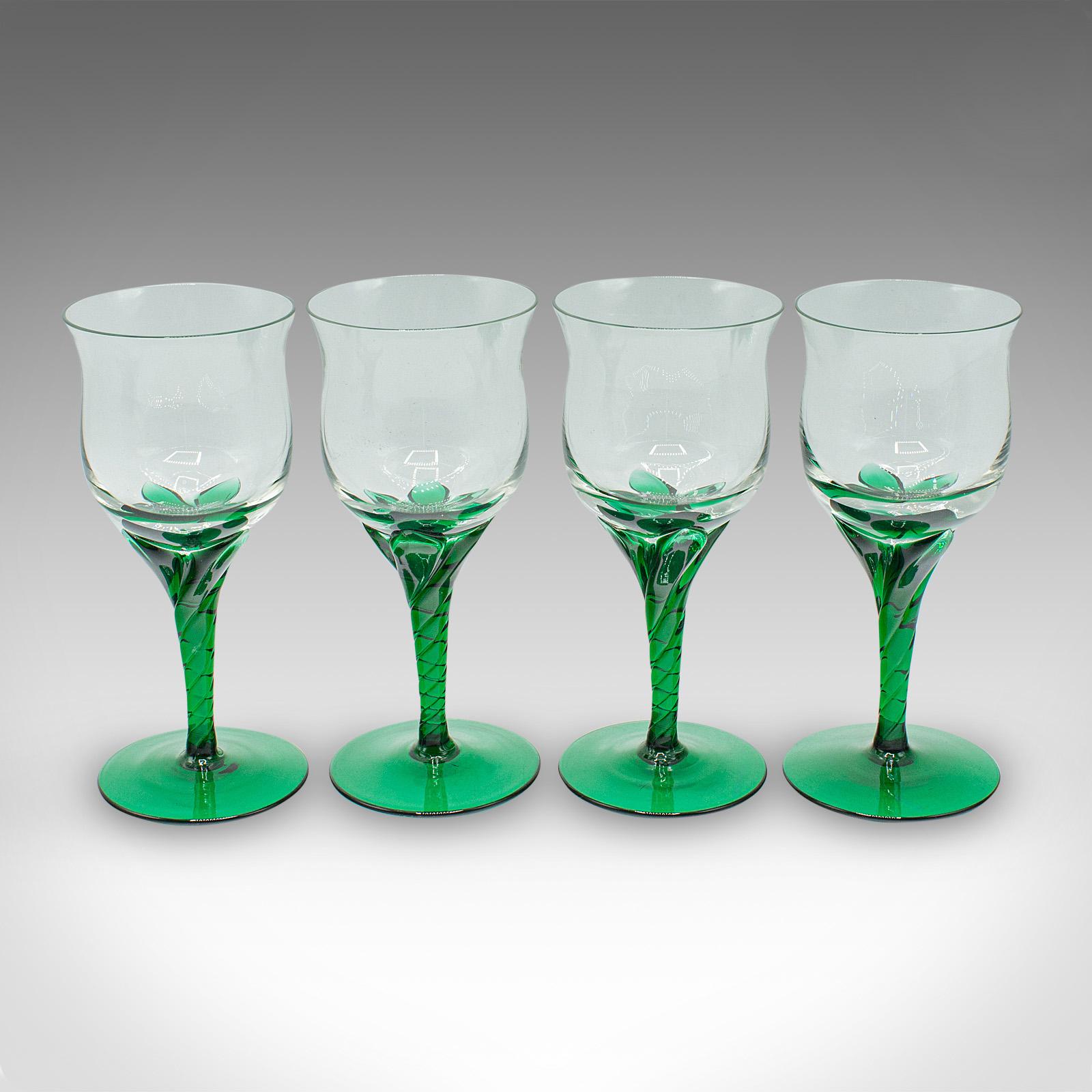 This is a set of 4 vintage aperitif glasses. A French, blown glass spirit flute set, dating to the late Art Deco period, circa 1940. A charming quartet with elegant form and striking colour contrast, ideal for refined entertaining or