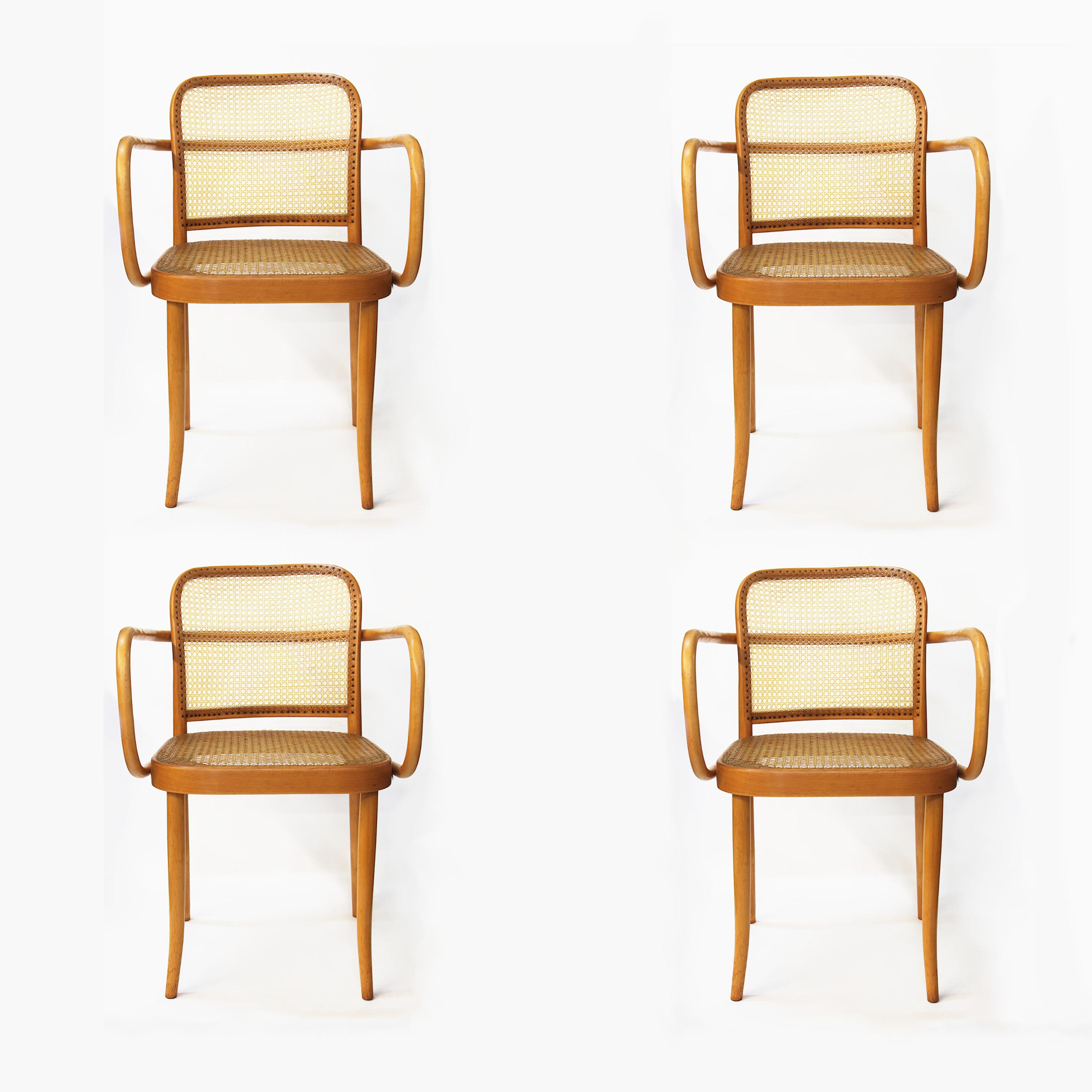 Wonderful set of four dining chairs designed by Josef Frank and Josef Hoffmann for Stendig. Chairs feature swooping, bentwood birch frames, handwoven cane seats/backs, and that iconic Bauhaus, 