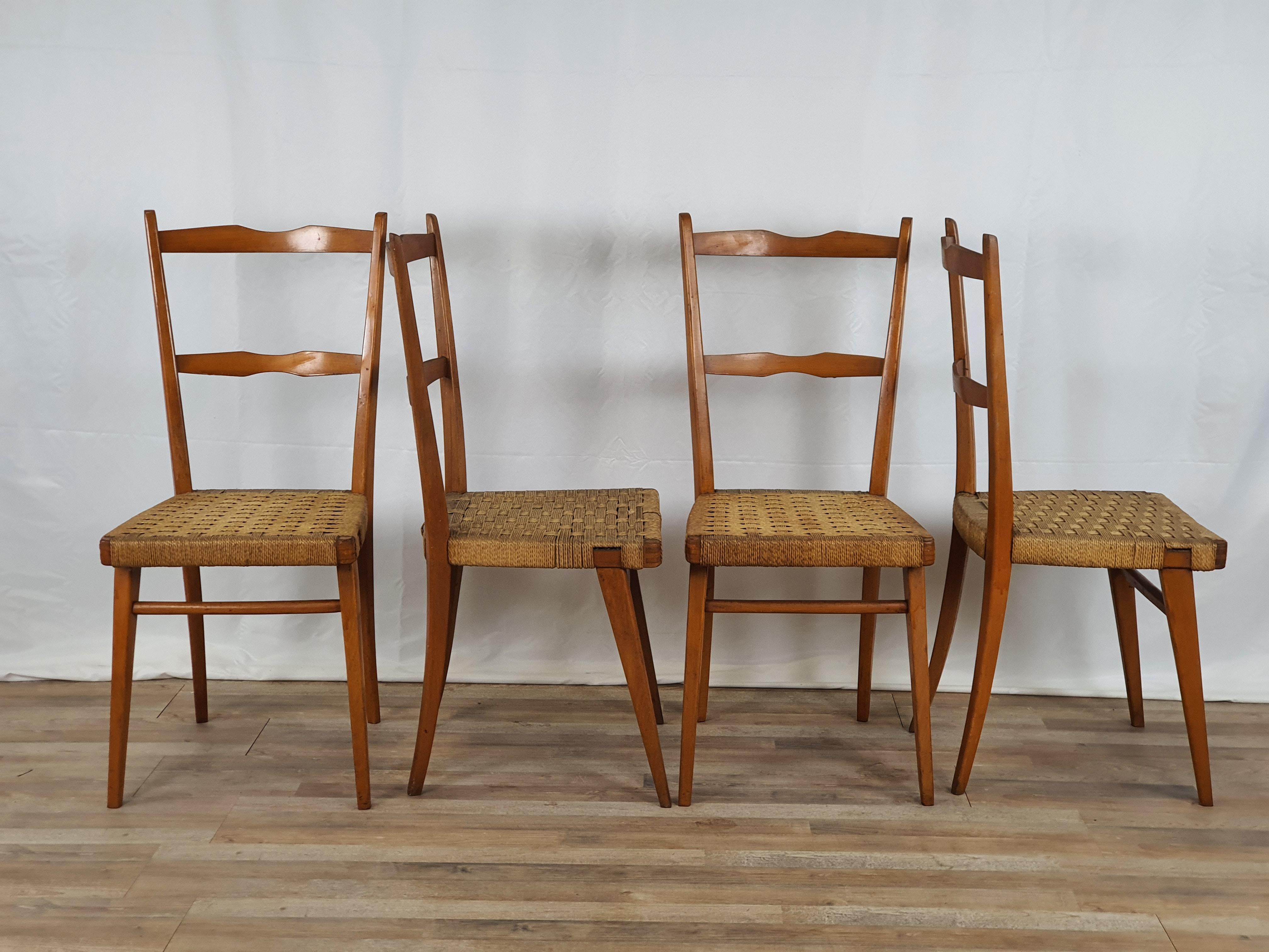 Set of dining room chairs with a very light and linear design, ideal for vintage rooms or modern and antique environments.

They are entirely in beechwood with an original period woven rope seat, early 1950s, Italian production.

The chairs are