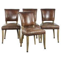 Set of 4 vintage cowhide and wooden dining chairs