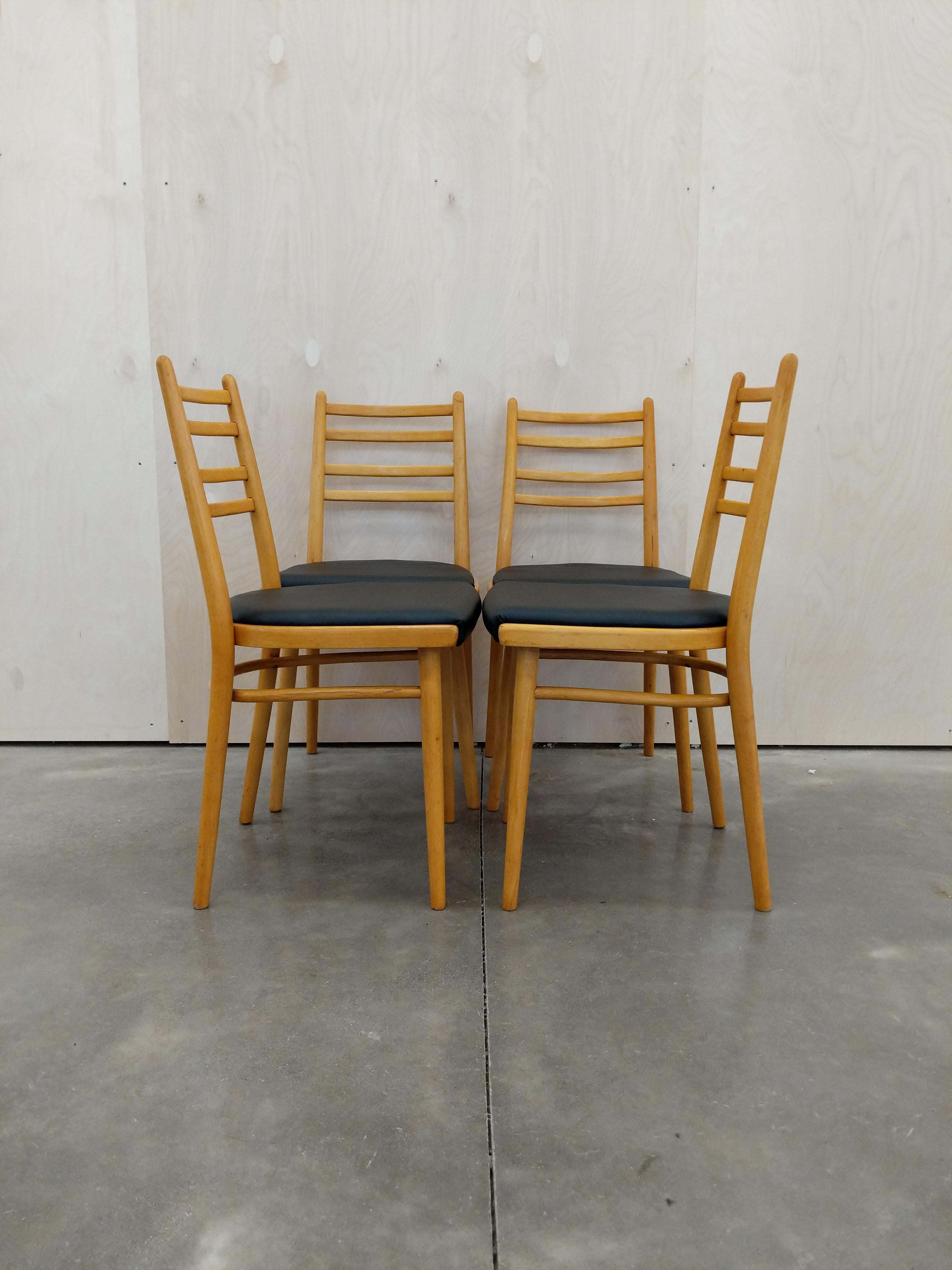 Set of 4 authentic vintage Czech mid century modern dining chairs.

This set is in excellent vintage condition with brand new upholstery (see photos).

If you would like any additional details, please contact us.

Dimensions:
32.5” tall to