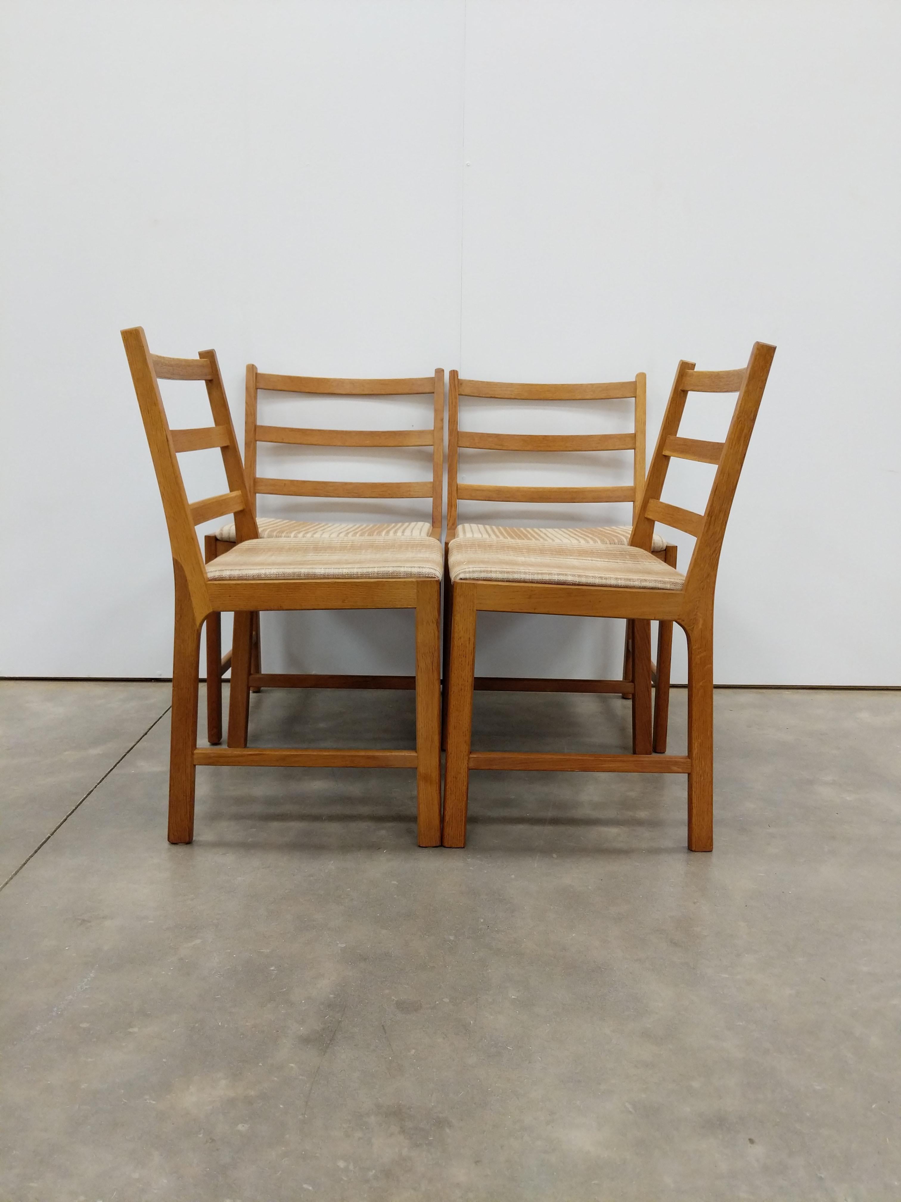 Set of 4 authentic vintage mid century Danish / Scandinavian Modern oak dining chairs.

This set is in excellent condition with brand new upholstery (see photos).

If you would like any additional details, please contact us.

Dimensions:
32.5” tall