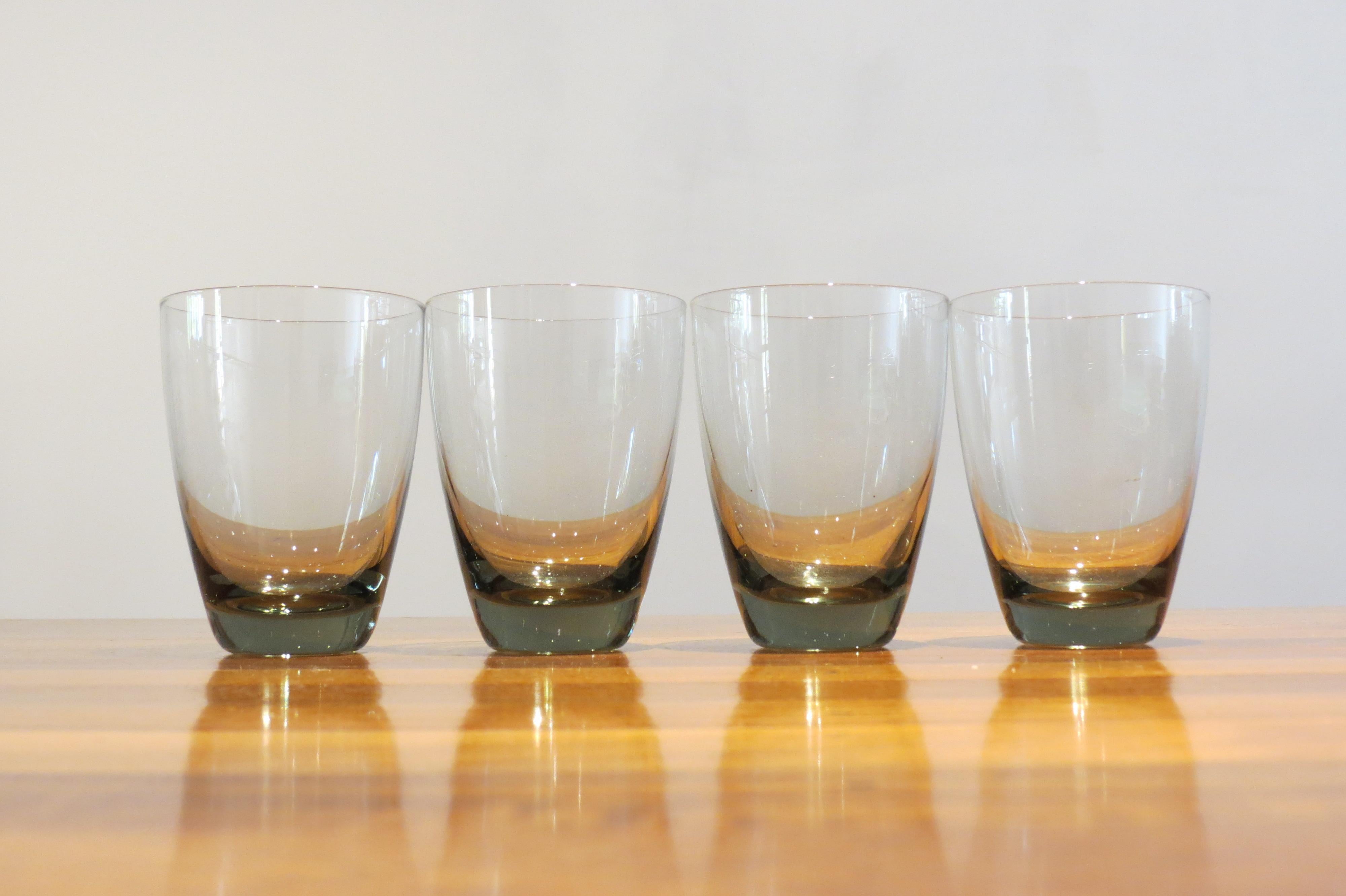 A set of four vintage Holmegaard, Denmark glasses.
Designed by Per Lutken, model Copenhagen, 1950s.
Smoked glass
Good condition
Measures: 6cm tall, 7cm diameter widest point
St930.

 
