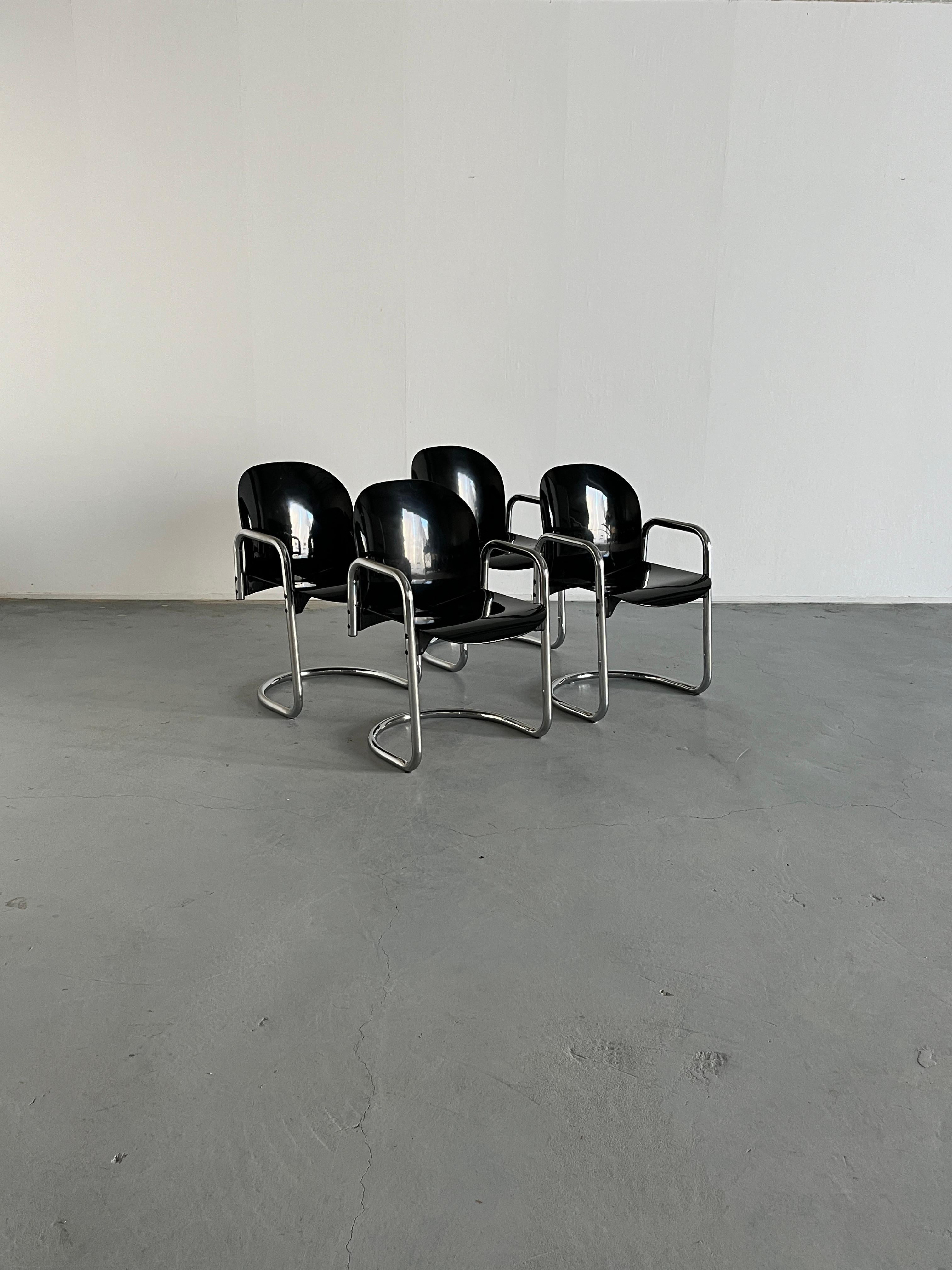 Set of four 'Dialogo' chromed dining chairs by Afra and Tobia Scarpa for B&B Italia, 1970s.
The 'Dialogo' model, also known as 'Dessau' model in later production (or 'Dialogo Dessau), with its distinctive cantilevered base and integrated armrests,