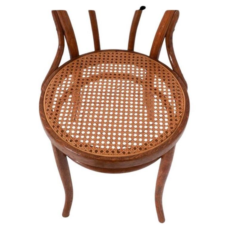 Set of (4) vintage cane seat cafe chairs by Thonet. model No. 18 chairs. They are in original condition with nice patina. The frames have a medium Brown Walnut wood is clean and ready for use. All Cane is in hand done and original - all (4) chairs