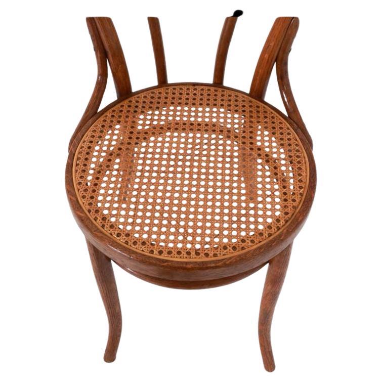 Set of (4) vintage cane seat cafe chairs by Thonet. model No. 18 chairs. They are in original condition with nice patina. The frames have a medium Brown Walnut wood is clean and ready for use. All Cane is in hand done and original - all (4) chairs