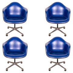 Set of 4 Used Eames Herman Miller Molded Fiberglass Blue Leather Swivel Chair