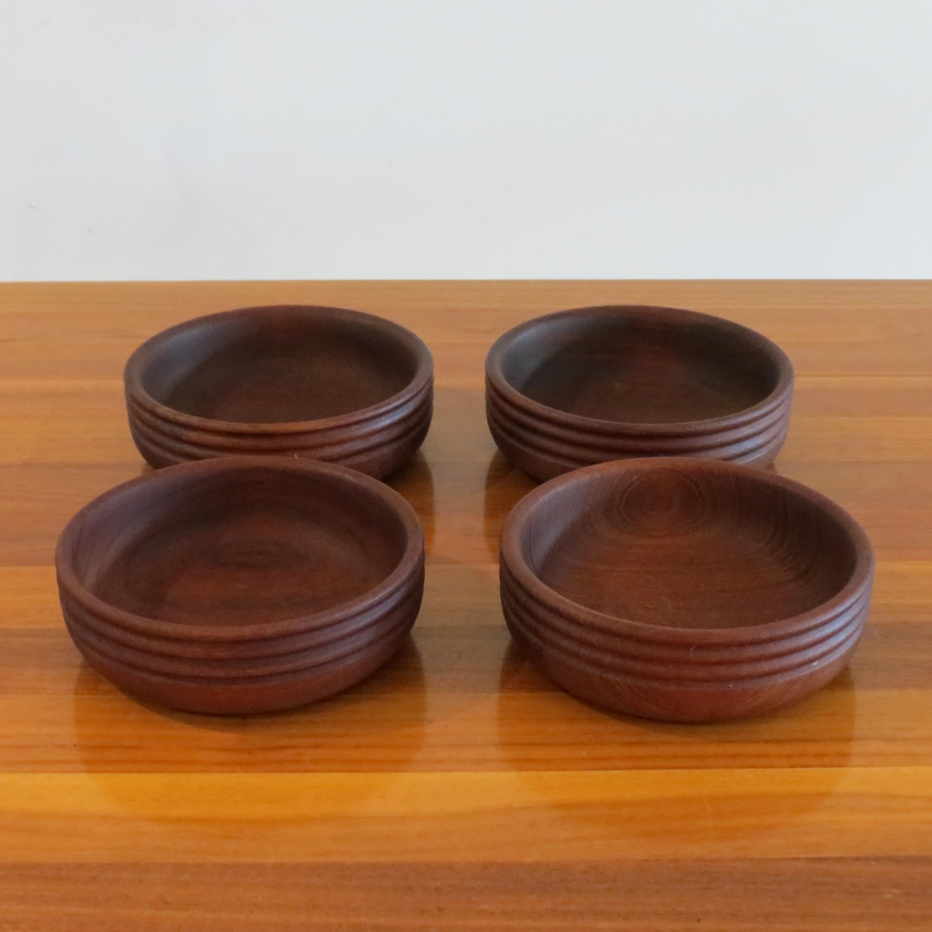 Wonderful set of 4 teak bowls, hand produced by Galatix, England.
Date from the 1960s.
In good condition, very nice turned detail to the outside of each bowl.
Stamped to the underside Galatix Handmade in England Burma Teak
ST1275.
  