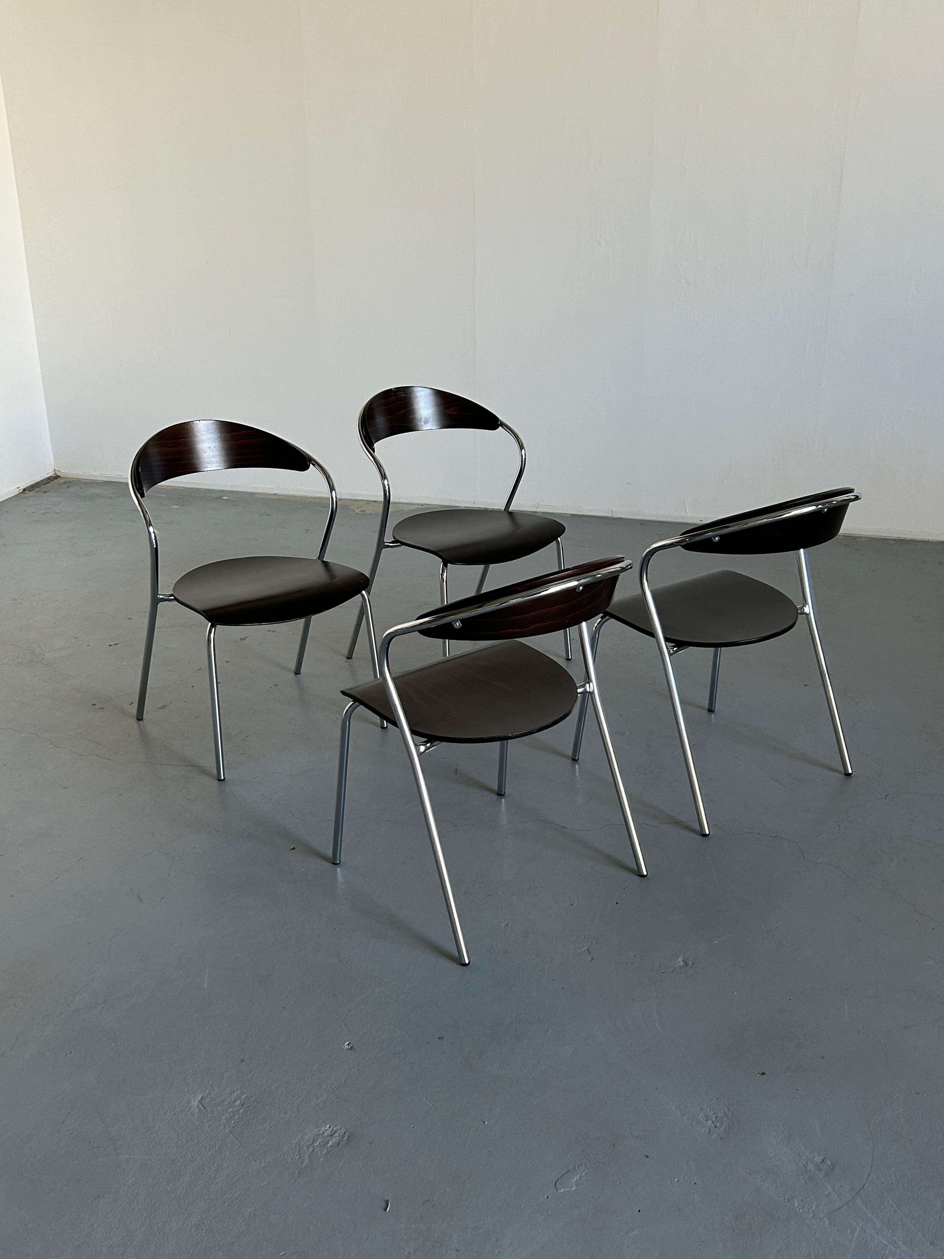 Set of four Italian postmodern dining chairs, made from chromed metal frame with a curved structure and plywood seat and backrest.
The design of the chair shows strong Italian postmodern influences.
Unique design, high quality materials and