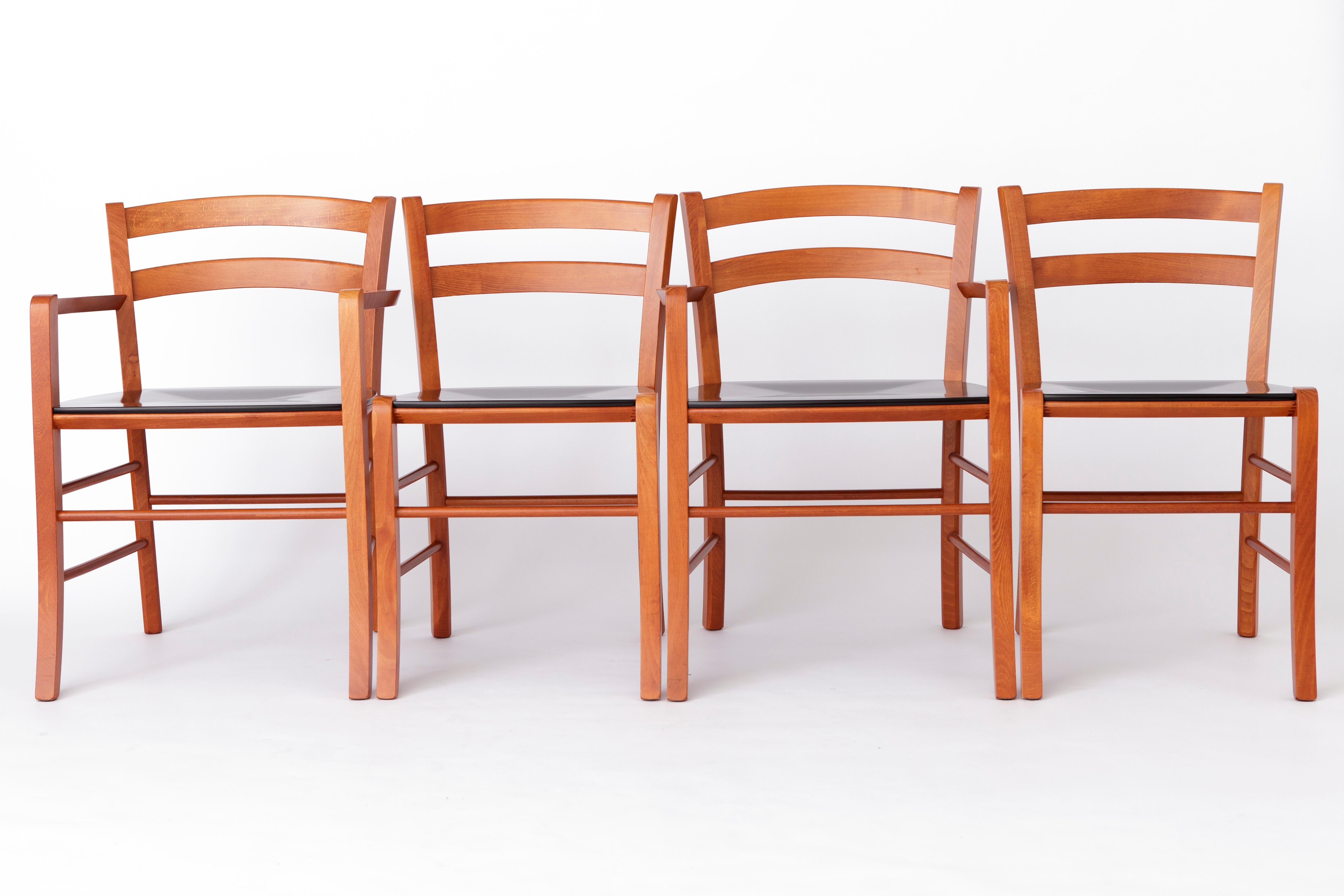 Set of 4 Italian Vintage chairs from the 1980s. 
Manufacturer: De Padova, Italy. Model: Marocca
Displayed price is for a set of 4. (2 armchairs + 2 side chairs). 

Sturdy beech wood frame. 
The seat is finished with black lacquer.
Wear consistent