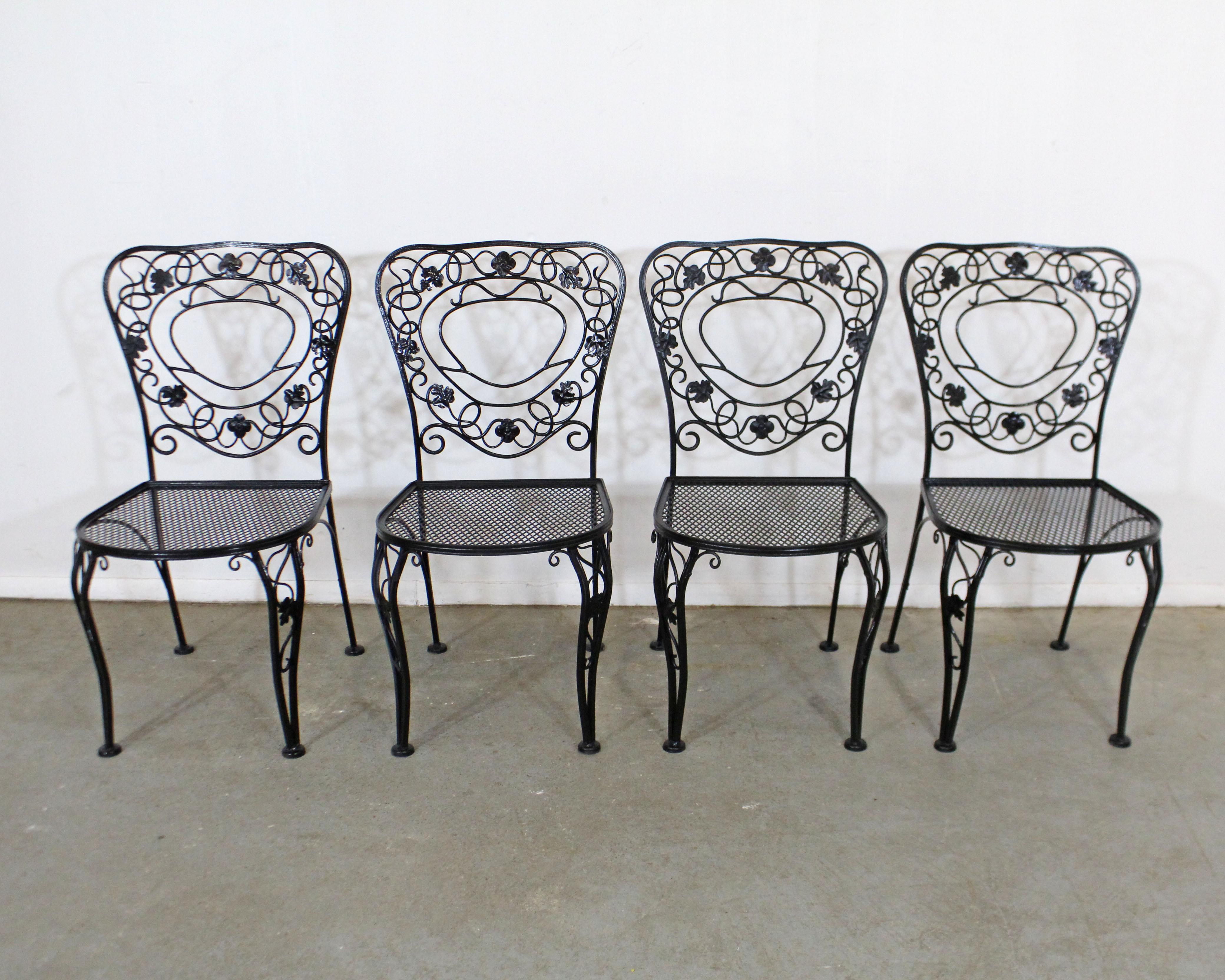 What a find. Offered is a set of 4 vintage wrought iron patio side chairs with dogwood leaf designs on the backs, curved legs, and mesh seats. Perfect for an outdoor patio space! The chairs are in good condition with some age wear. No cushions