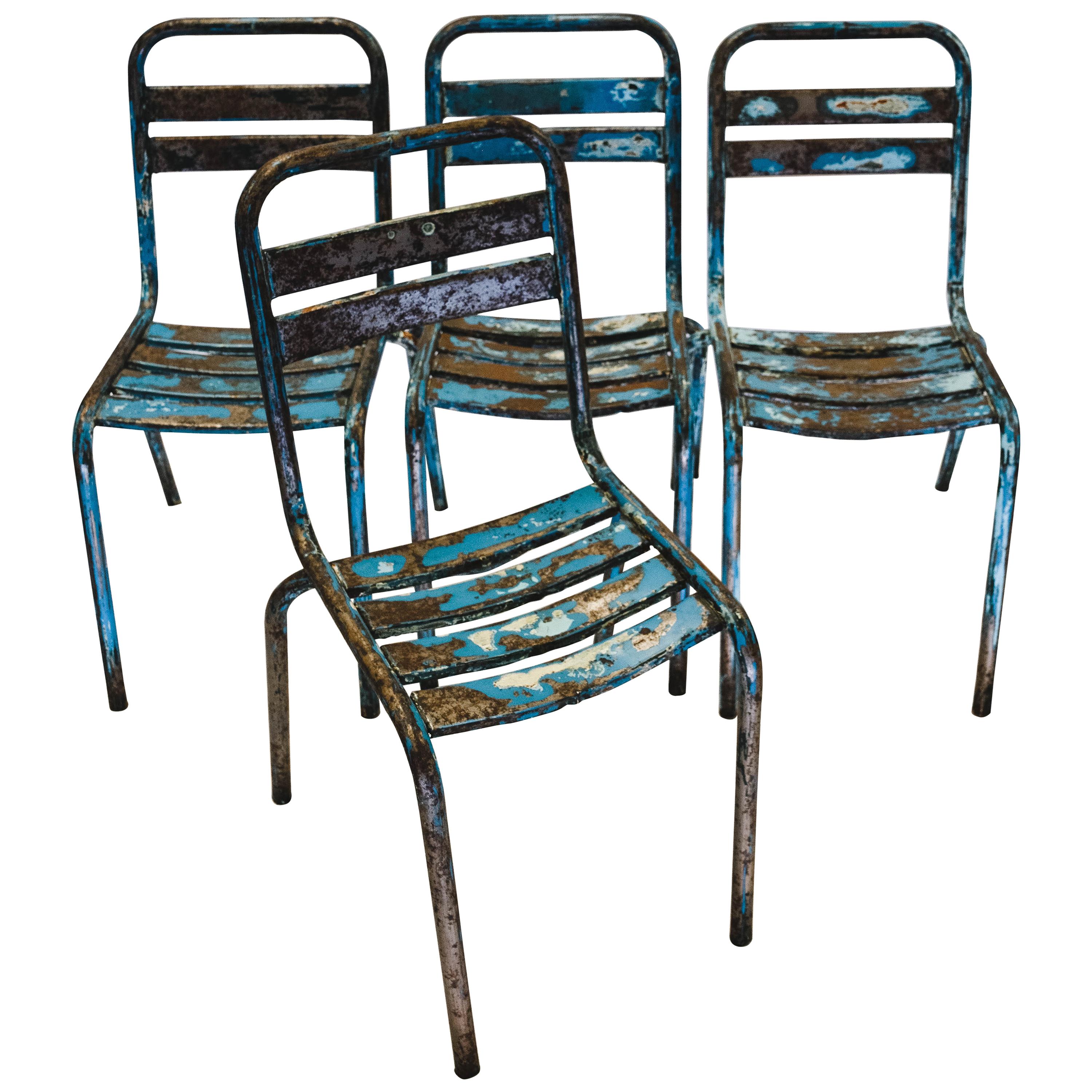 1950s vintage original French Tolix Industrial blue metal cafe dining chairs – set of four.
This Tolix model features a slatted seat and back with beautiful aged brass brazing marks. Painted in the original blue these chairs are in exceptional