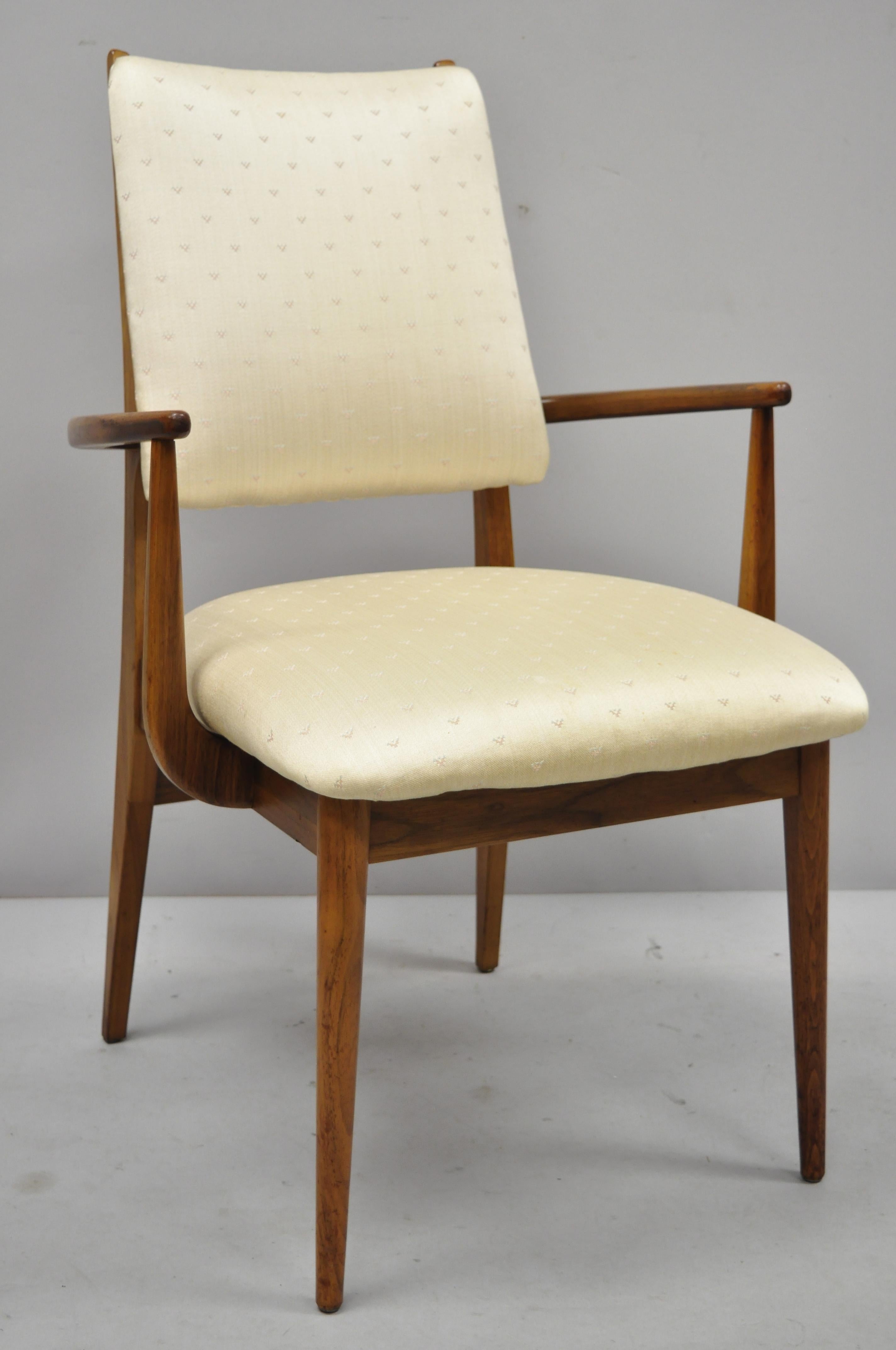 Set of 4 vintage mid century Danish modern walnut dining room chairs. Listing includes (2) armchairs, (2) side chairs, solid wood frame, beautiful wood grain, upholstered back end seat, tapered legs, clean modernist lines, sleek sculptural form,