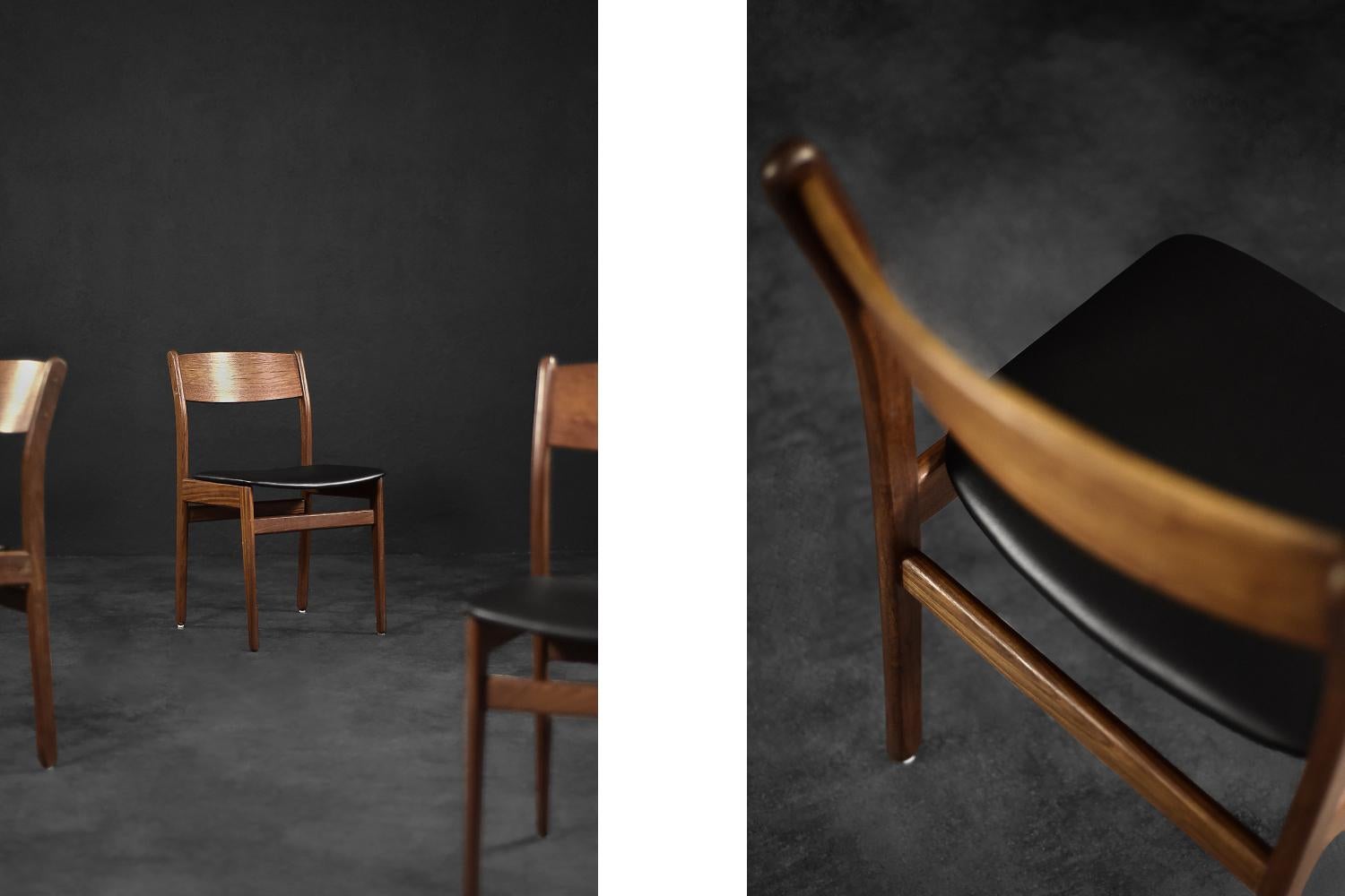 This set of four dining chairs was made in Denmark during the 1960s. The chairs are made of teak wood in a warm shade of brown. The seats have been reupholstered with high-quality black vinyl. The chairs have a minimalist Danish design. The simple