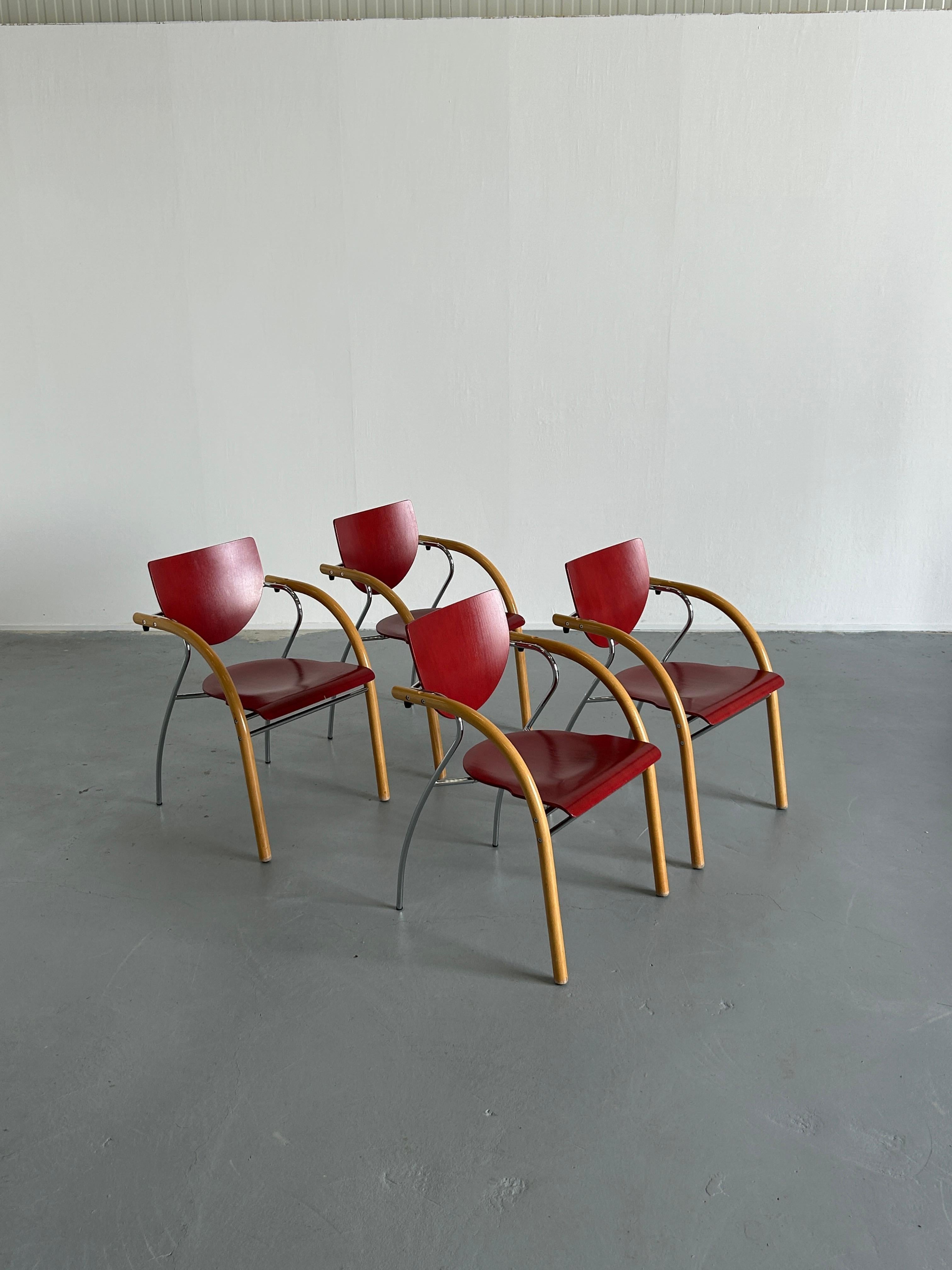 Set of four postmodern Memphis era, original Thonet dining chairs. Sculptural, geometrically shaped colourful structure.

Produced by Thonet Vienna during the 1990s.
Signed.

Price is for the set of four pieces.

Quality made and in good