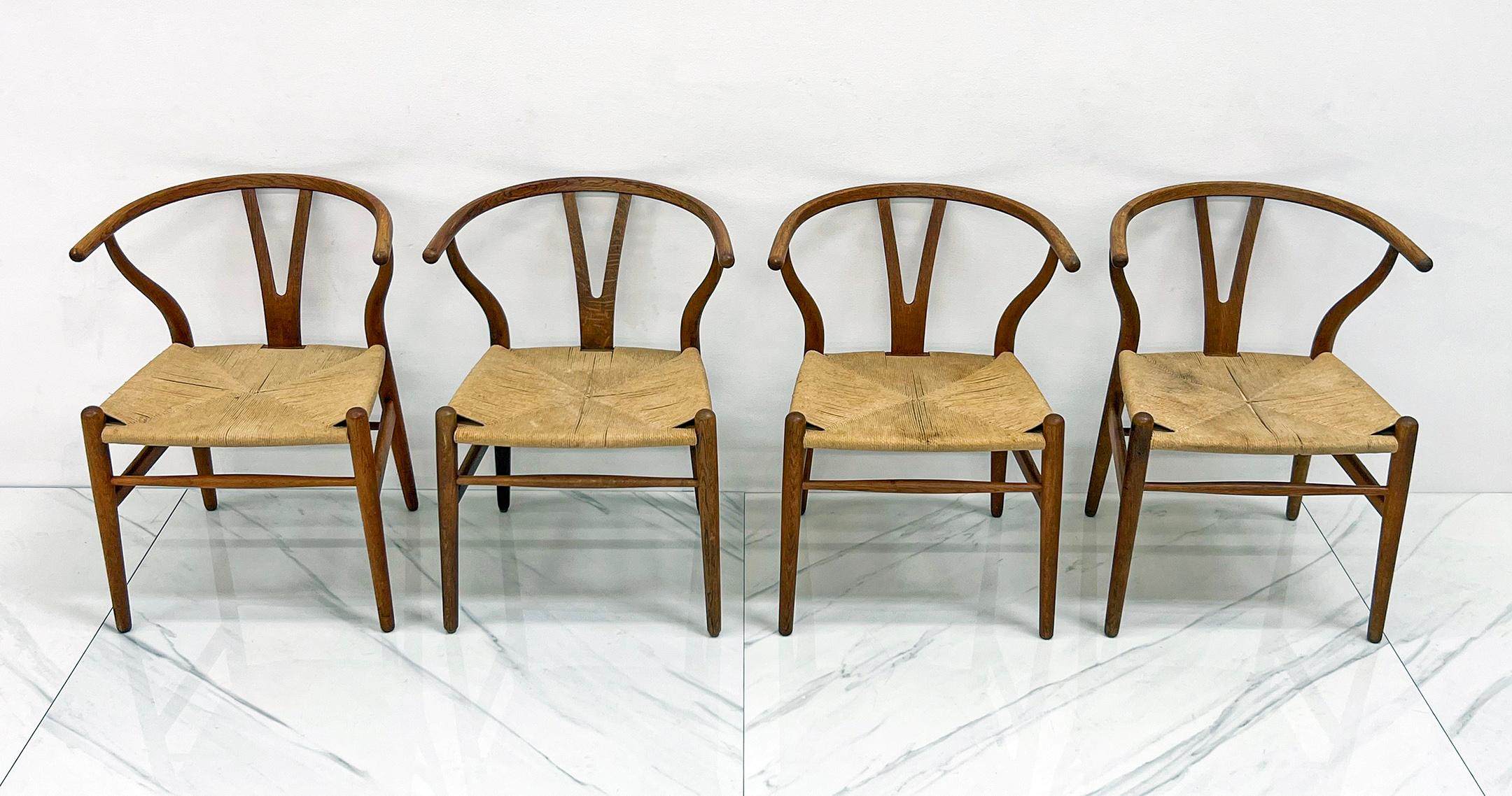 Danish Set of 4 Vintage Patinated Hans Wegner CH24 Wishbone Dining Chairs in Oak