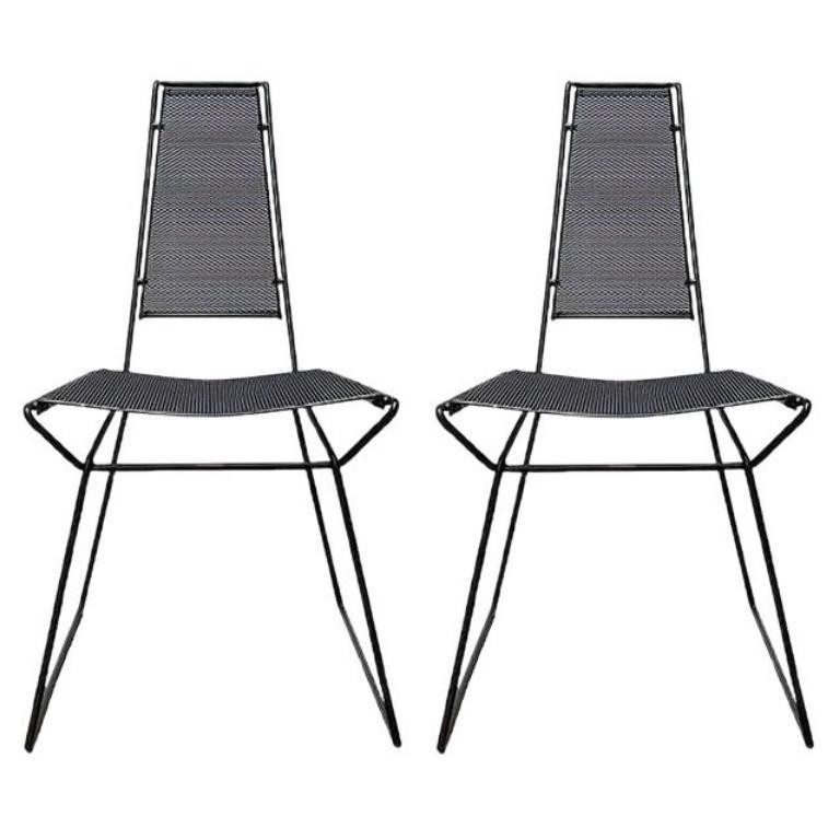 Postmodern metal chairs designed by Rolf Rahmlow in the 80s.

The frame of the chair is made of round bars, which are precisely connected. Seat and backrest are made of perforated sheet metal and set off in black. This piece has an attribution