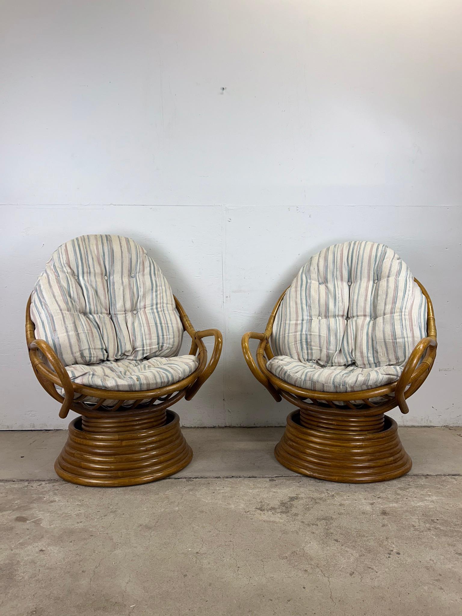 This set of four vintage lounge chairs feature rattan construction, original finish, vintage striped upholstered cushions, and swivel base.  Check out my other rattan and boho chic item listings!

Dimensions: 29.5w 31d 36h 17sh 23ah

Condition