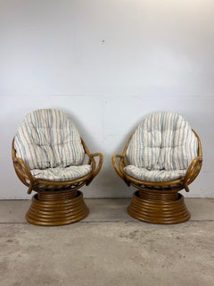 Set of 4 vintage rattan accent chairs with swivel base